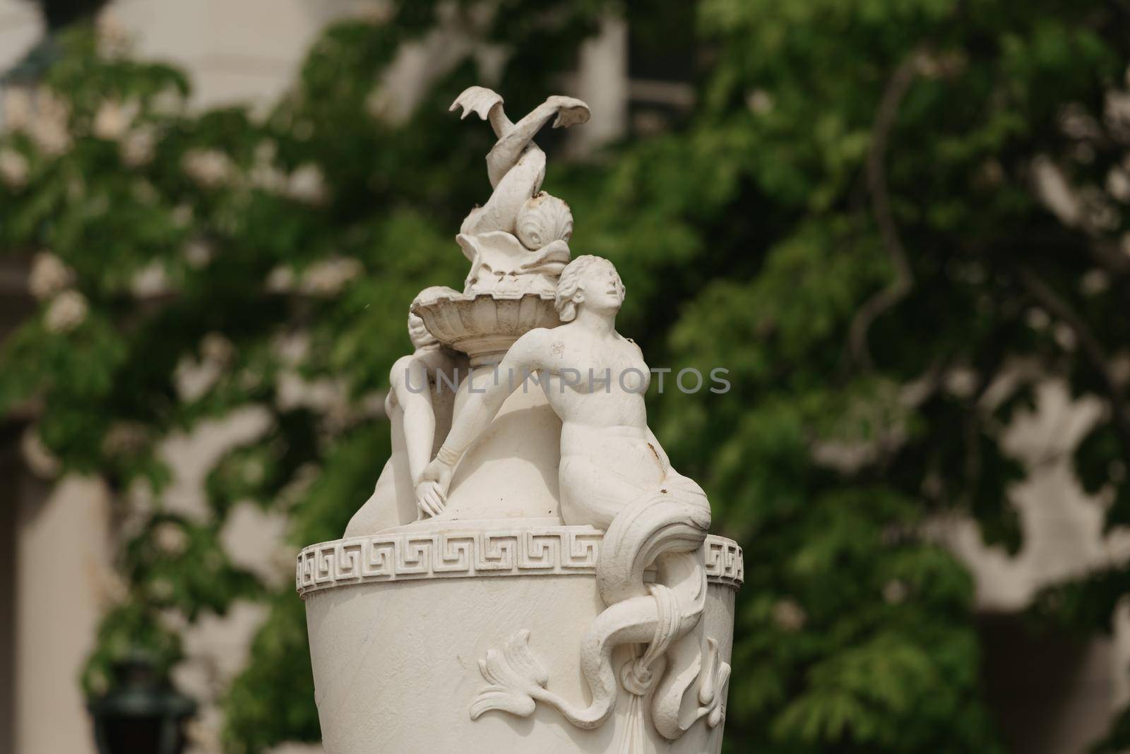 Warsaw, Poland - MAY 12, 2022: A head of the old outdoor vase with sculptures in Royal Baths Park, Lazienki Park