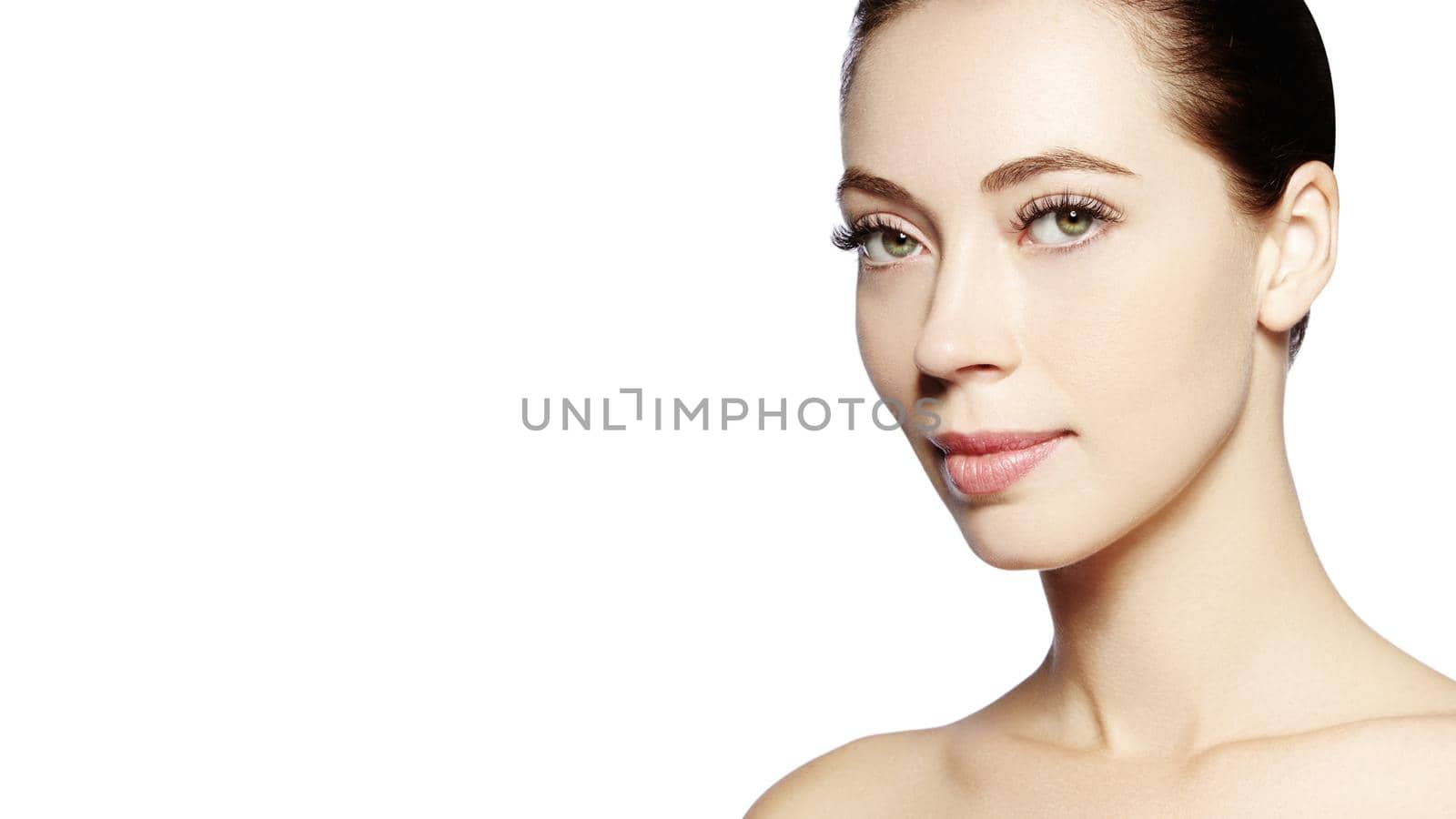 Beautiful face of young woman. Skincare, wellness, spa. Clean soft skin, healthy fresh look. Natural daily makeup.
