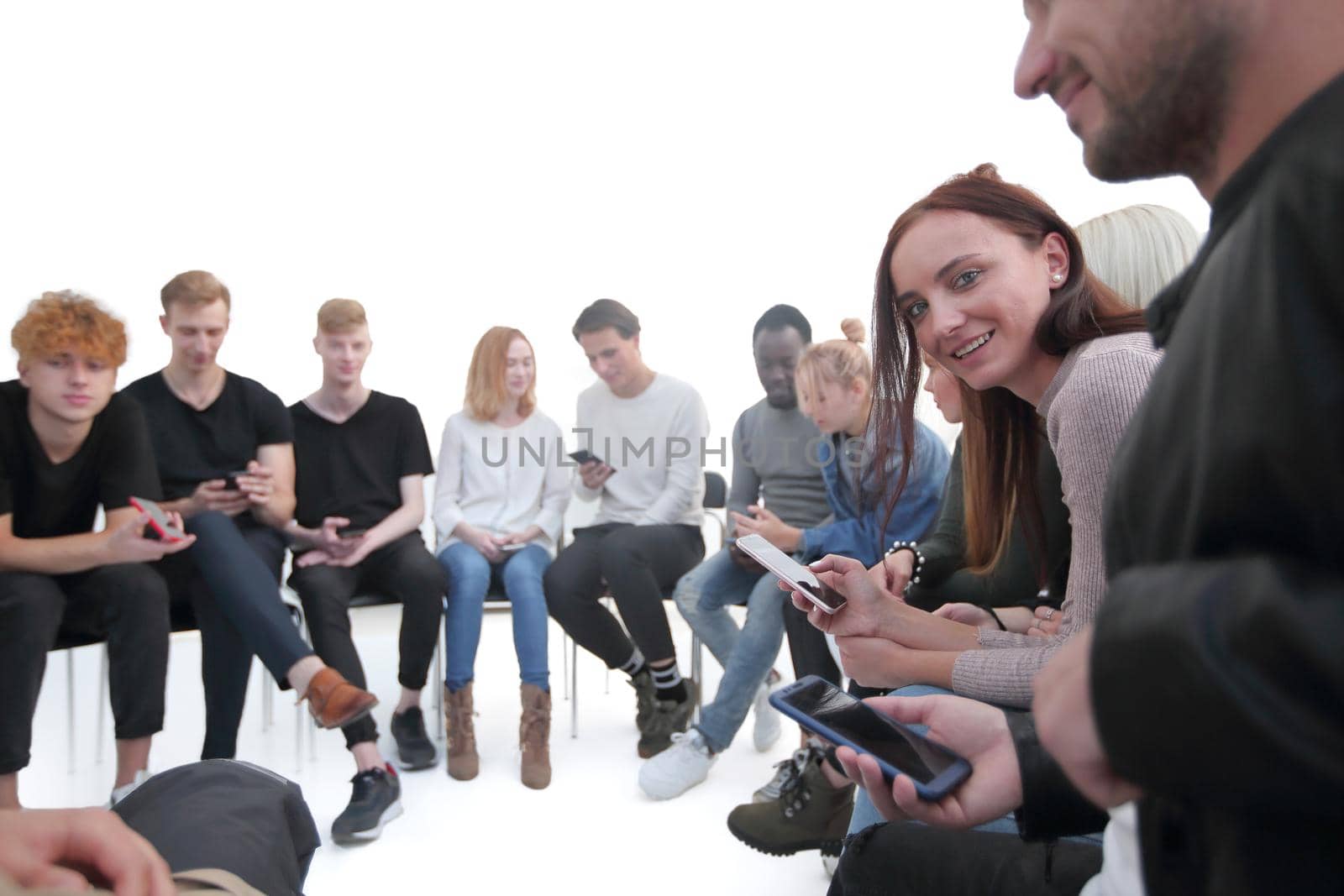 close up. diverse young people using their smartphones. photo with copy space