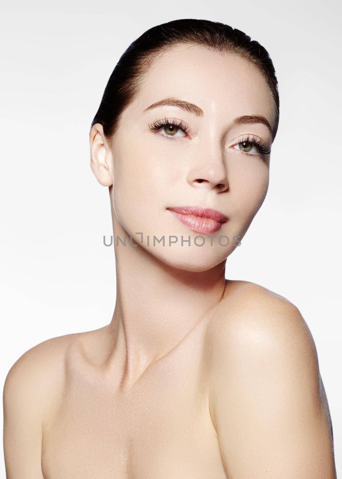 Beautiful face of young woman. Skincare, wellness, spa. Clean soft skin, healthy fresh look. Natural daily makeup.