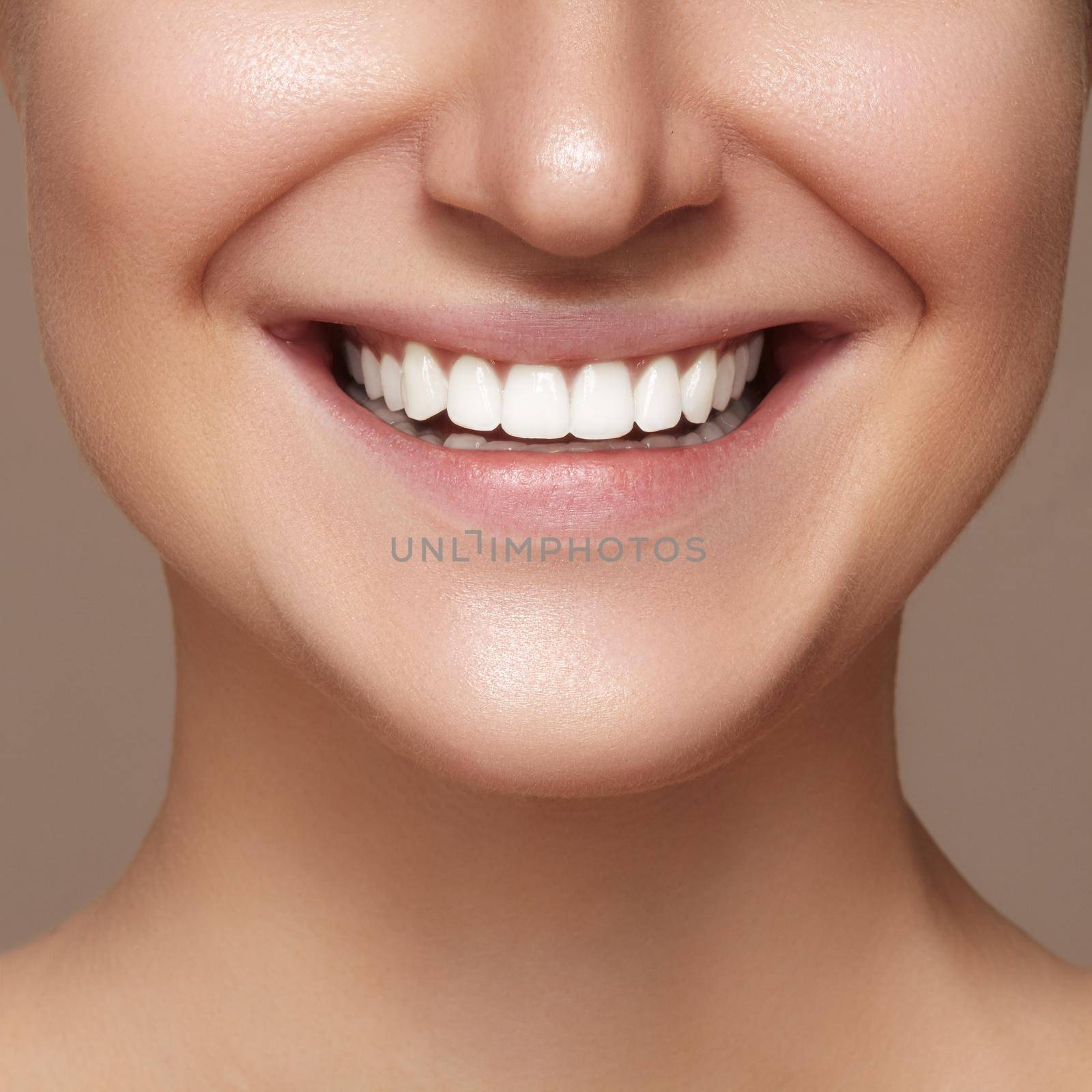Beautiful smile with whitening teeth. Dental photo. Macro closeup of perfect female mouth, lipscare rutine.