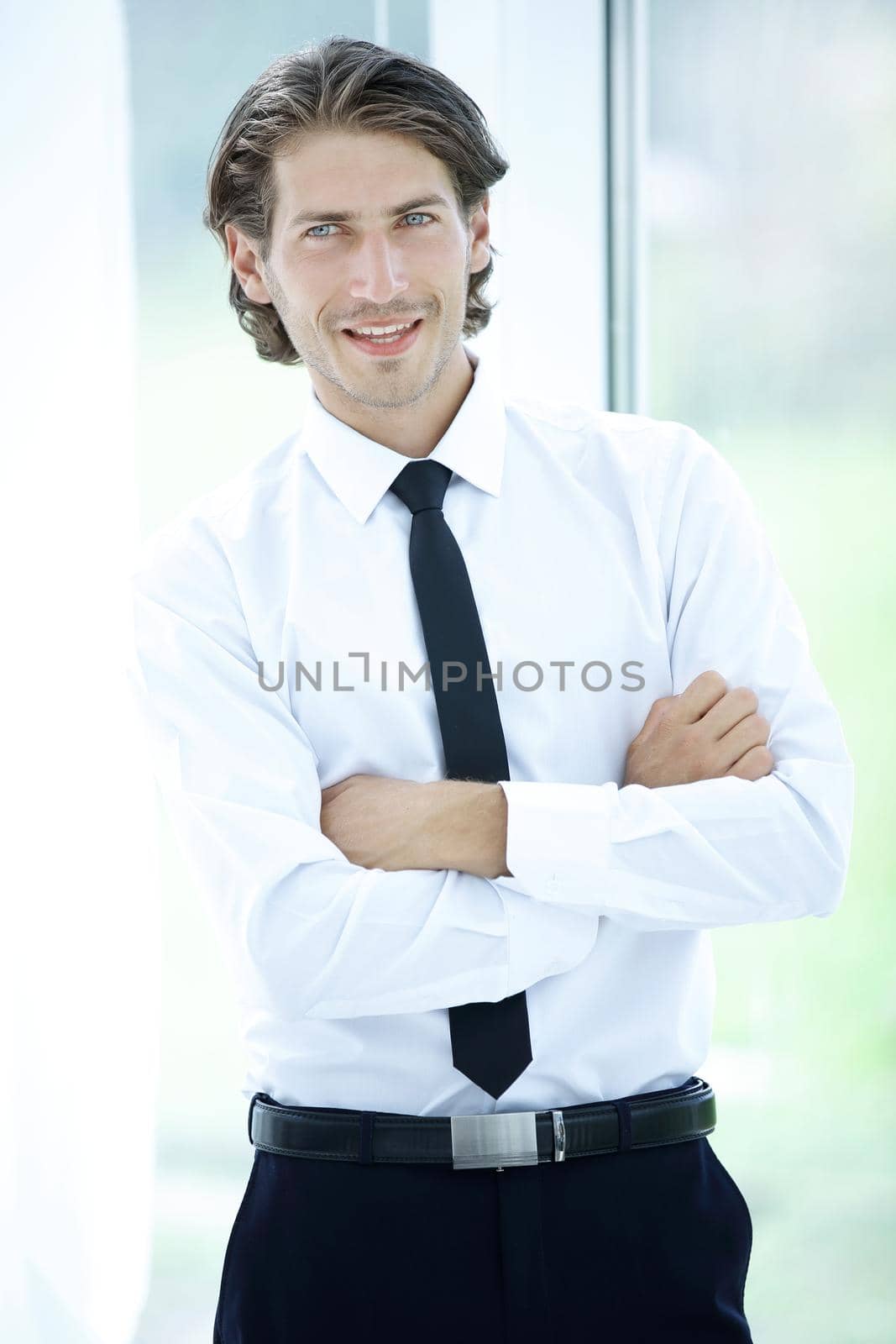 closeup.portrait of successful businessman on background of office