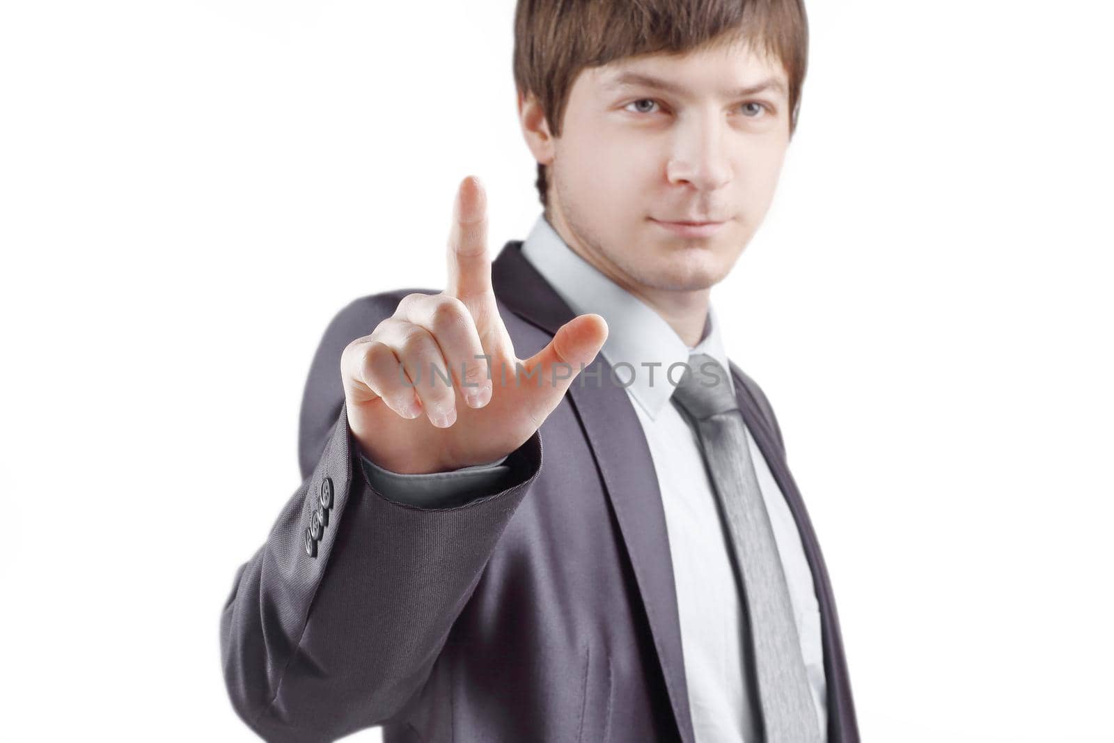 close up. businessman presses his finger on the virtual point.isolated on grey background.