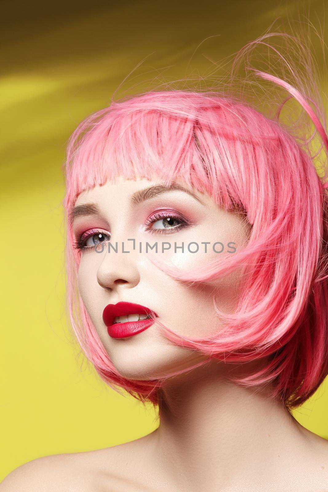Young woman in pink wig. Beautiful model with fashion makeup. Bright spring look. Sexy hair color, medium hairstyle by MarinaFrost