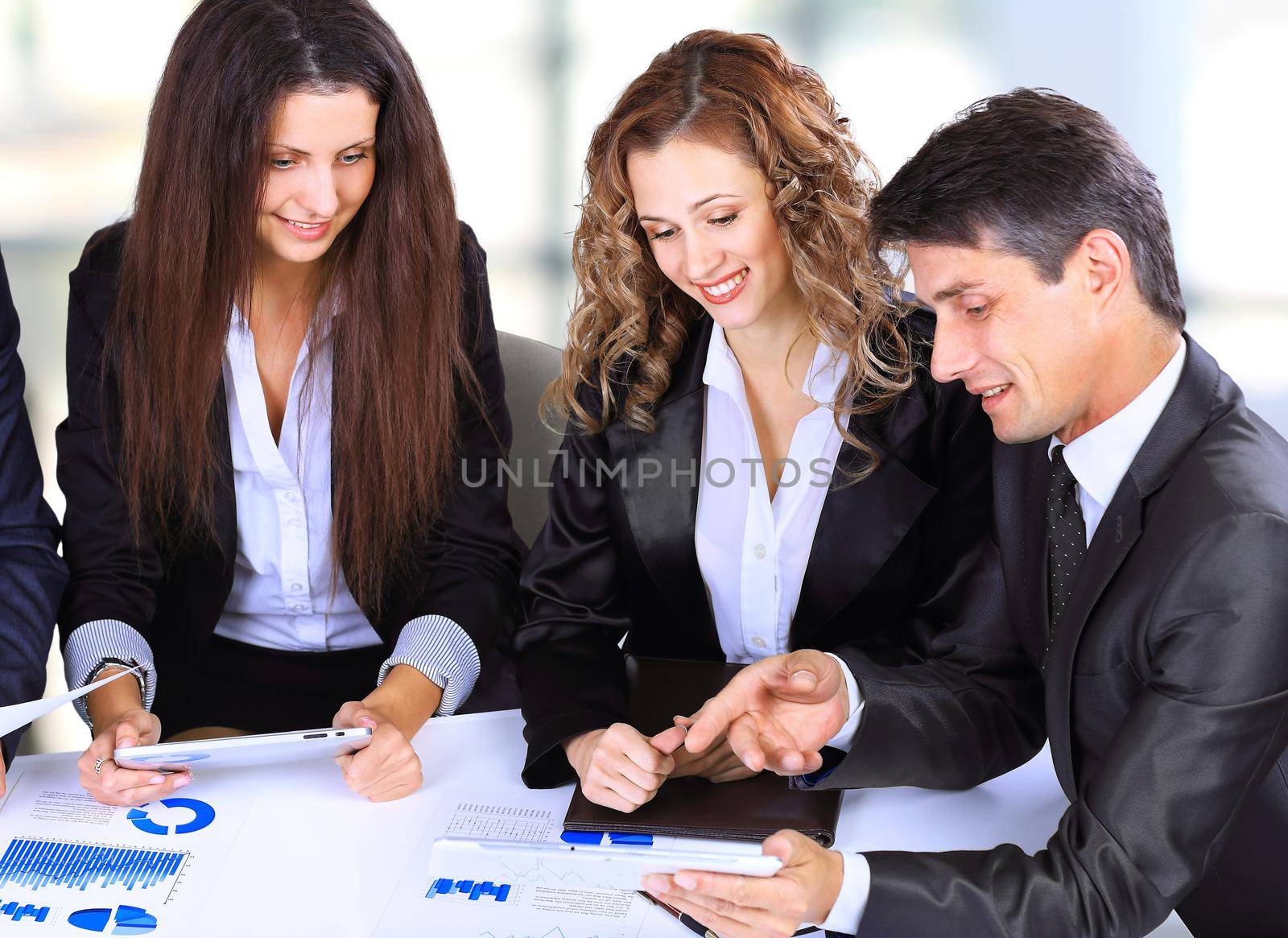 business, technology and office concept - smiling female boss talking to business team