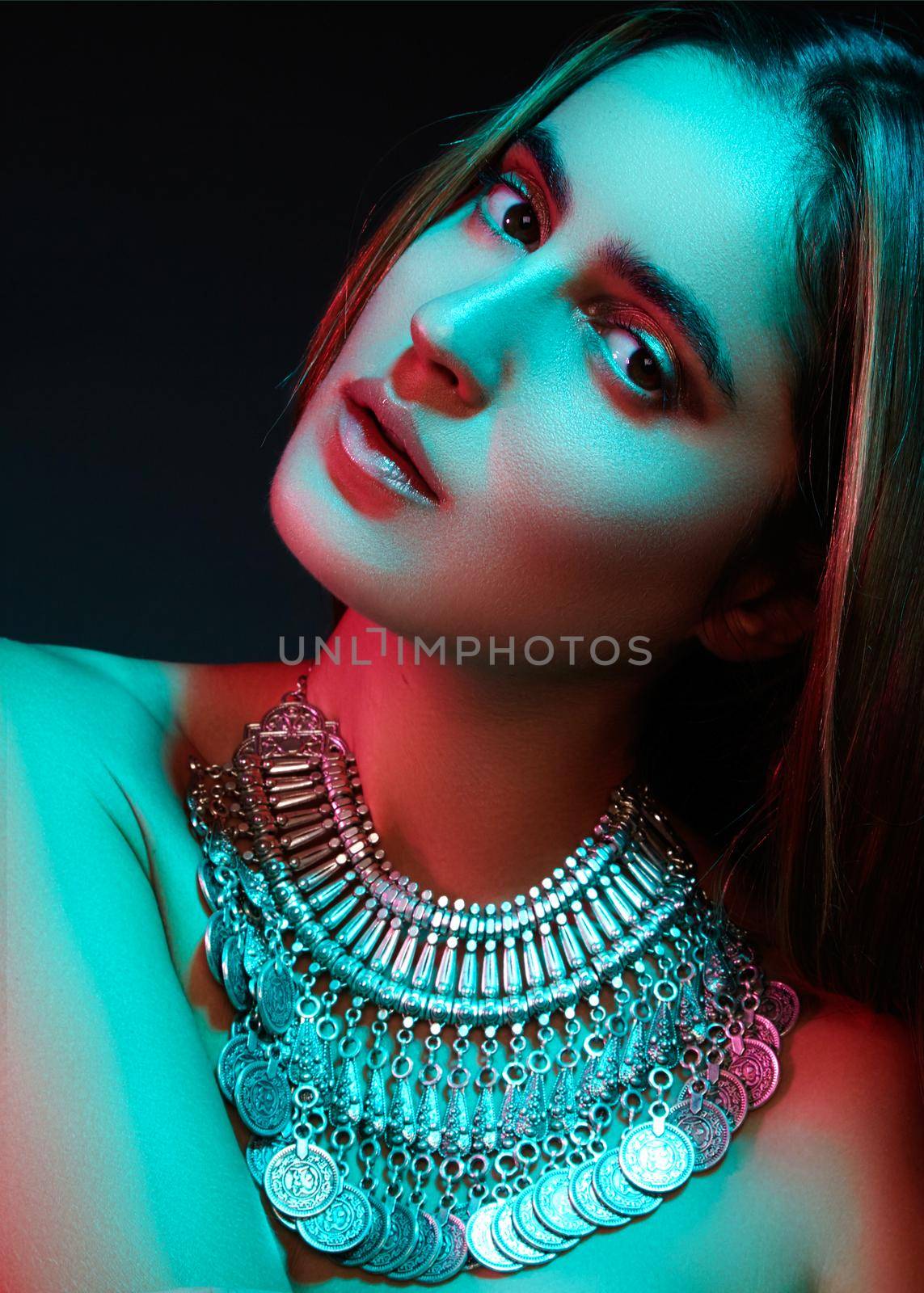 Beautiful woman in a necklace. Model in jewelry from silver. Beautiful indian jewellery. Bright lights by MarinaFrost