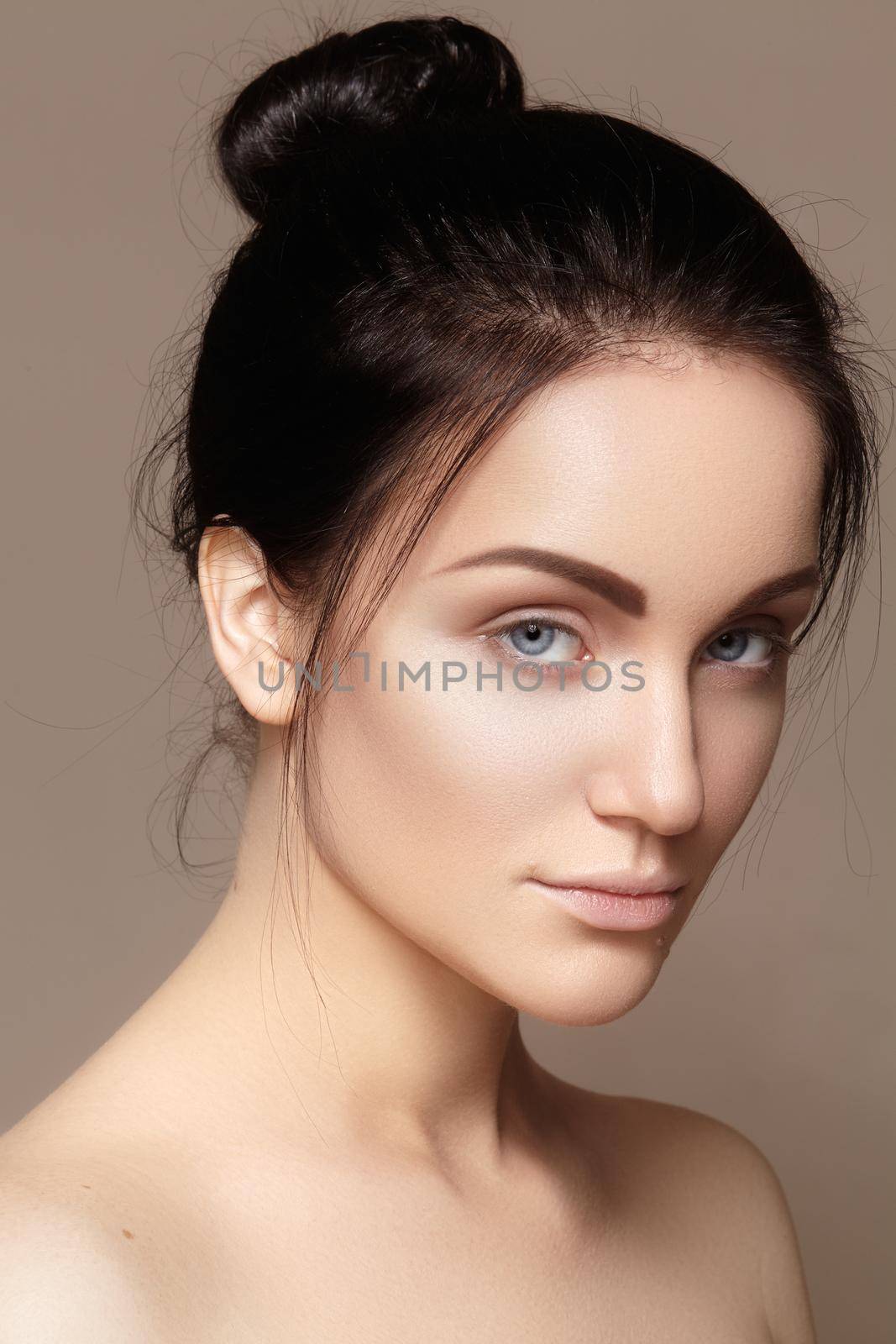 Beautiful young woman with perfect clean shiny skin, natural fashion makeup. Close-up woman, fresh spa look. Healthy beauty