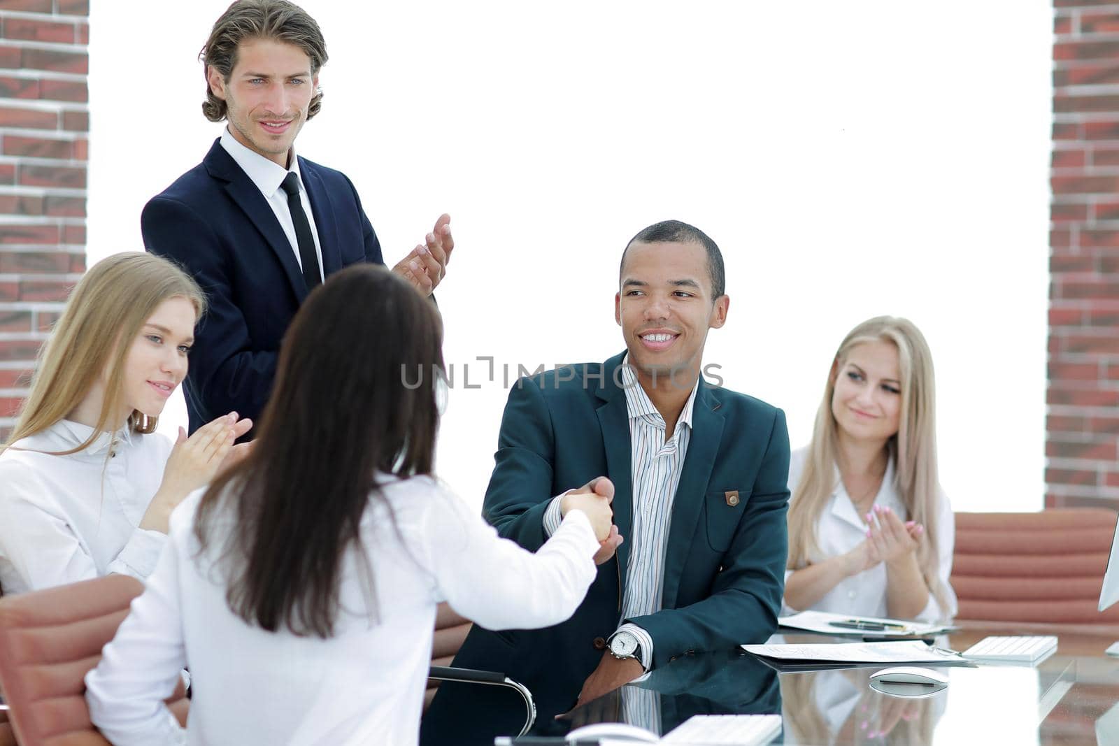 business team applauding business partners after signing the contract.the concept of cooperation