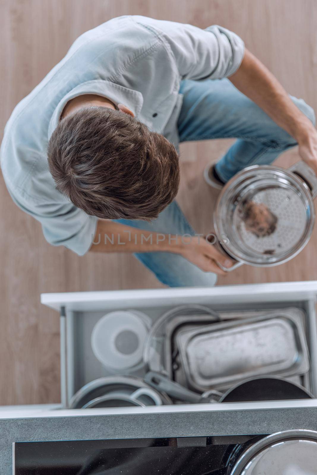 top view. a man taking out utensils from kitchen table by asdf