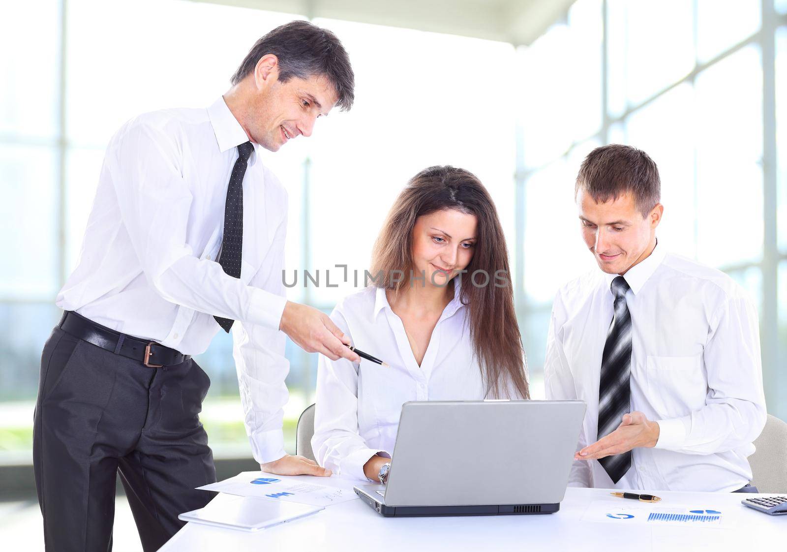 business, technology and office concept - smiling female boss talking to business team