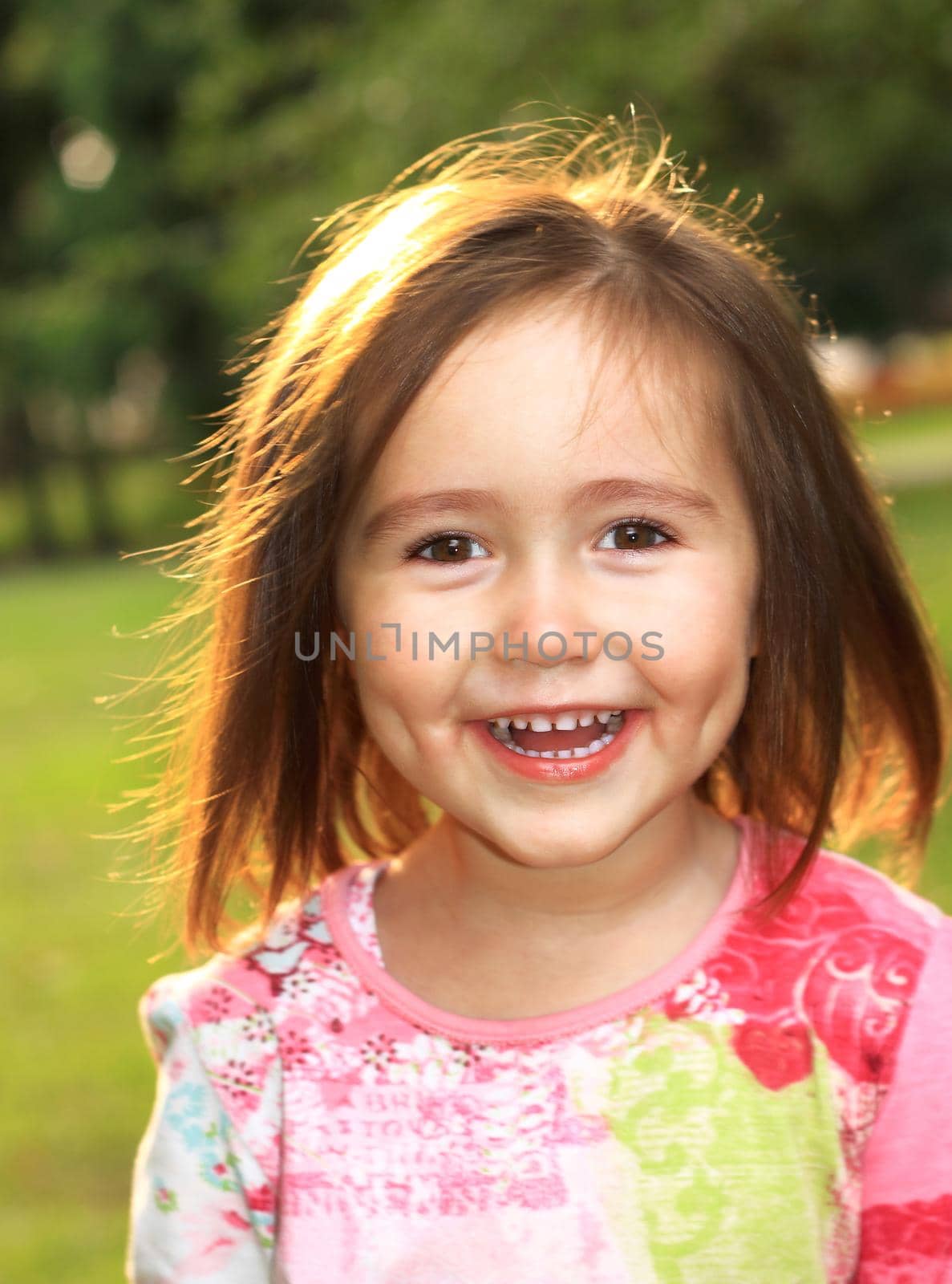 Cute little girl on the meadow in summer day by SmartPhotoLab