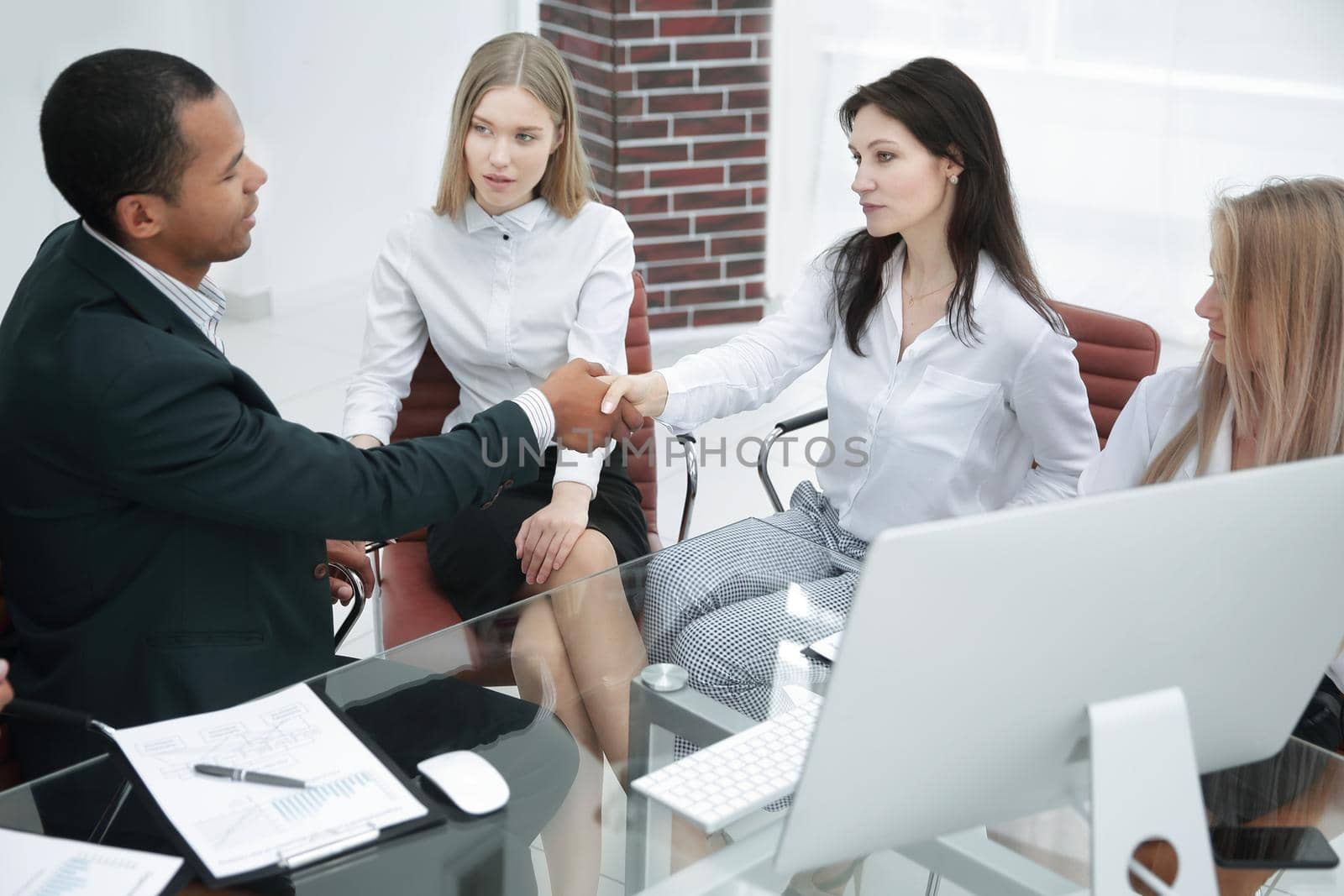handshake of business partners in a modern office.business concept