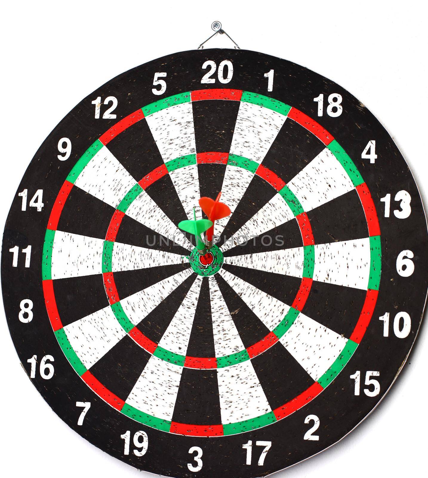 side view.Arrow dart hitting the center of the target dart Board.the concept of purpose.