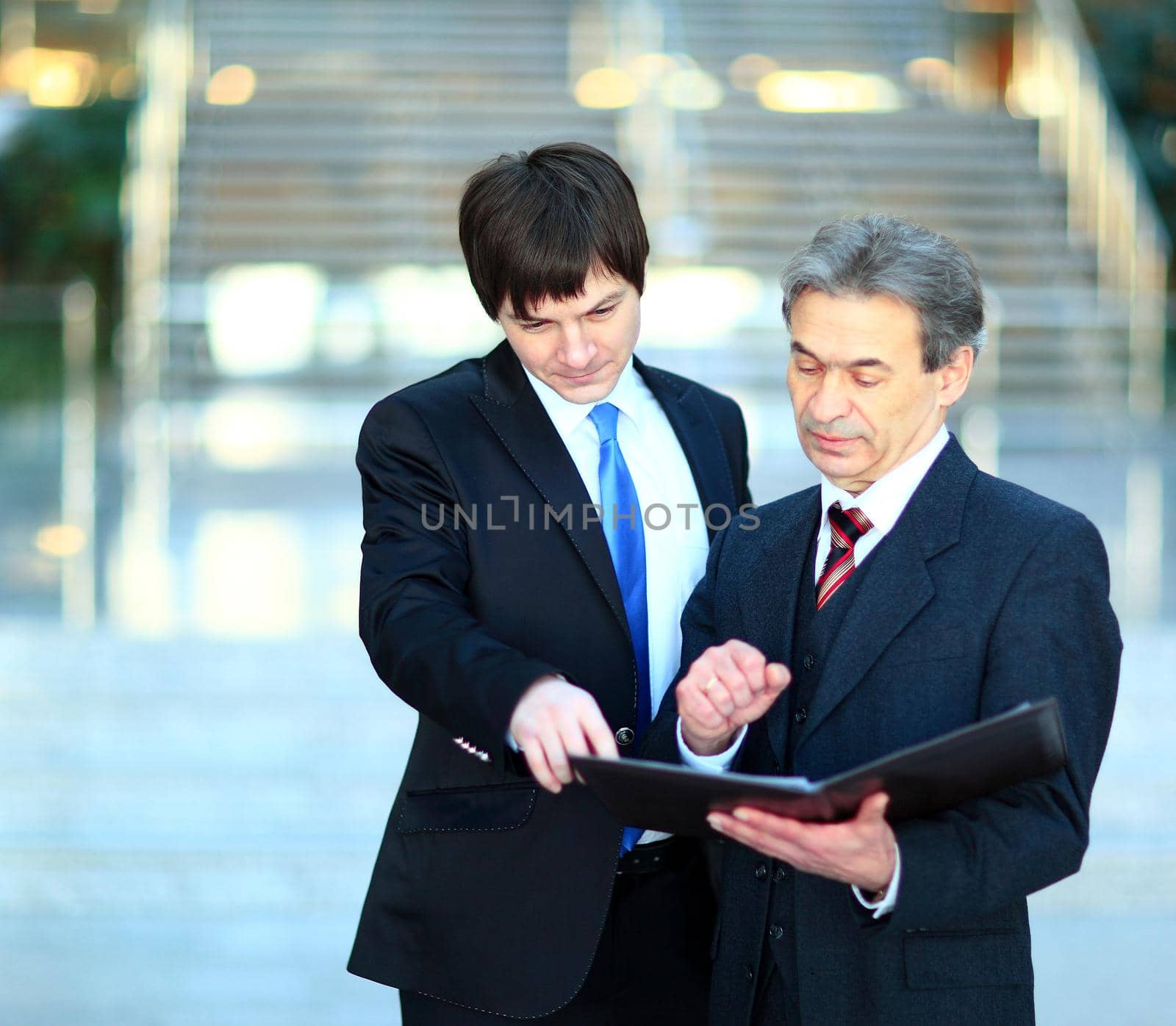 Image of smart boss explaining to colleague business idea