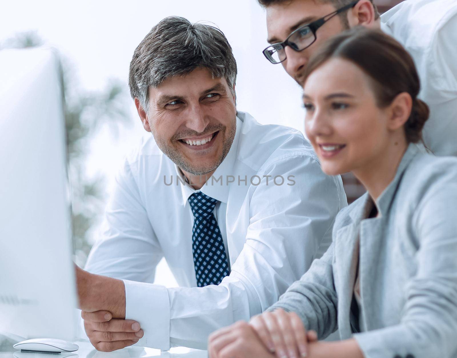 Business team discussing information sitting at the desk by asdf