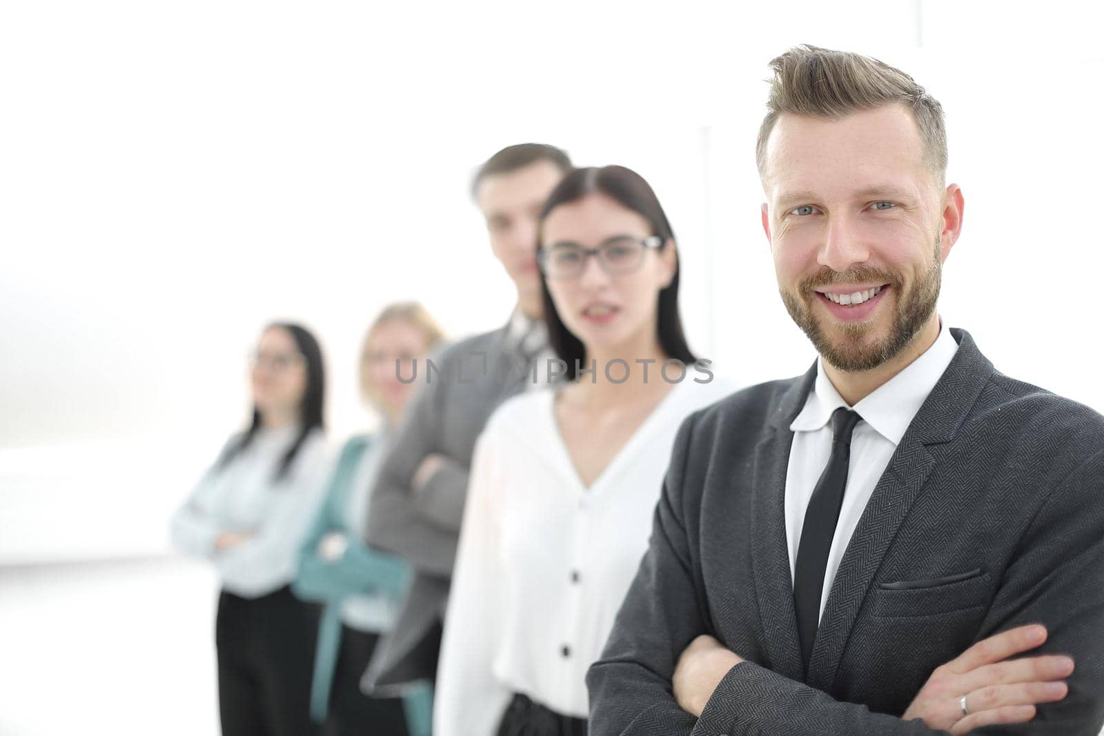 confident businessman standing in front of his business team.photo with copy space
