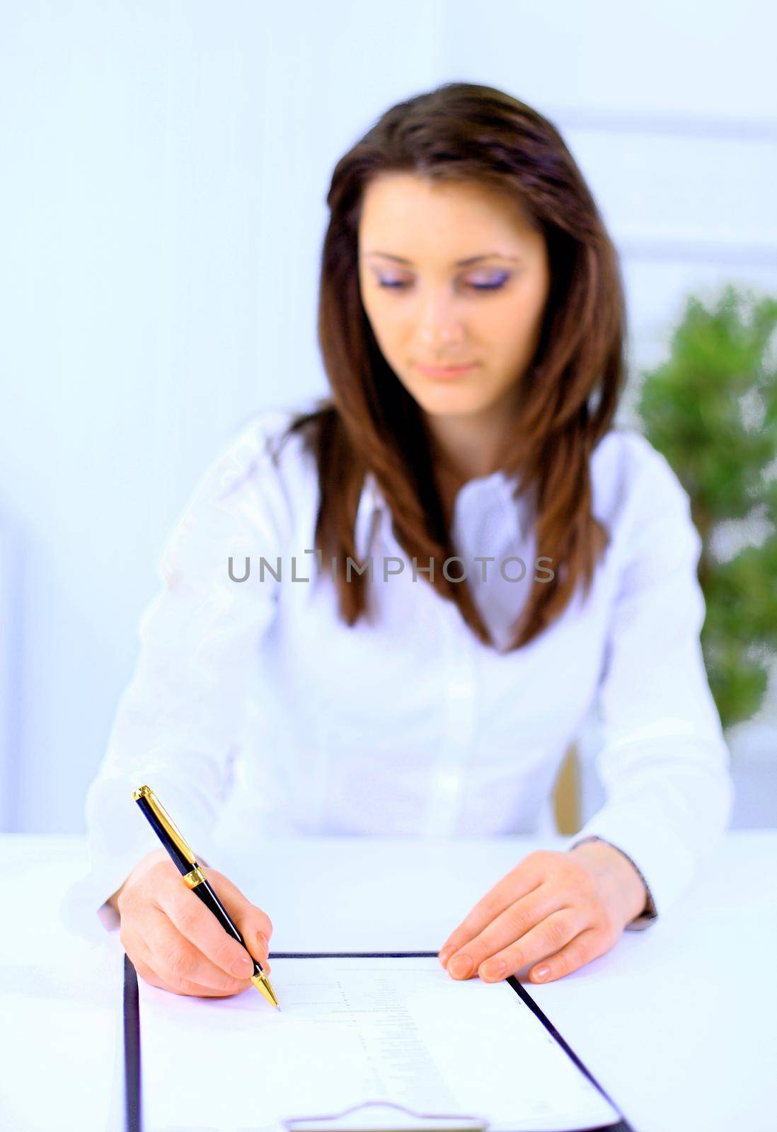 Beautiful business woman working at desk
