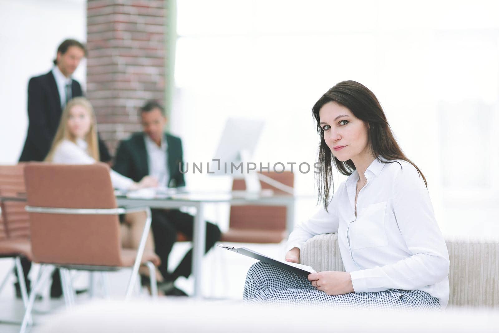 Executive business woman with documents on the background of the office.photo with copy space