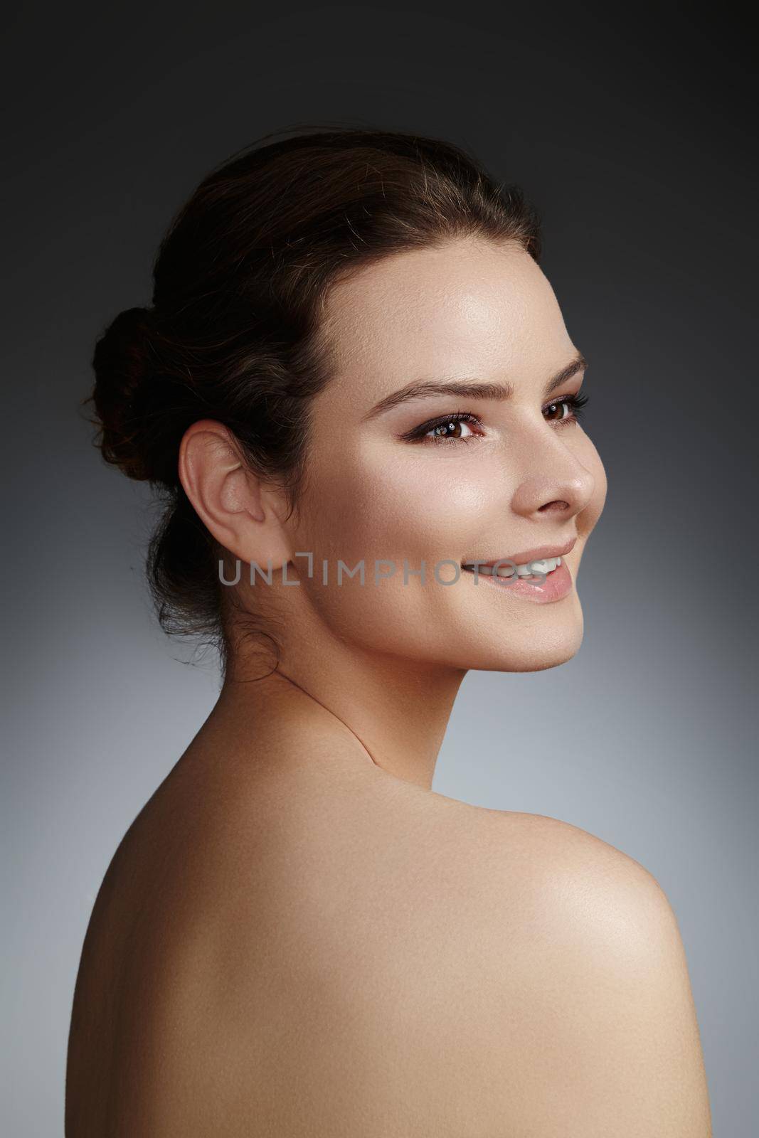 Beautiful face of young woman. Skincare, wellness, spa. Clean soft skin, healthy fresh look. Natural daily makeup.