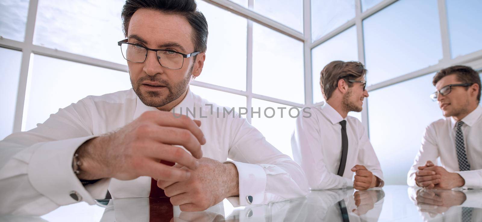 business colleagues sitting at the office table.business concept