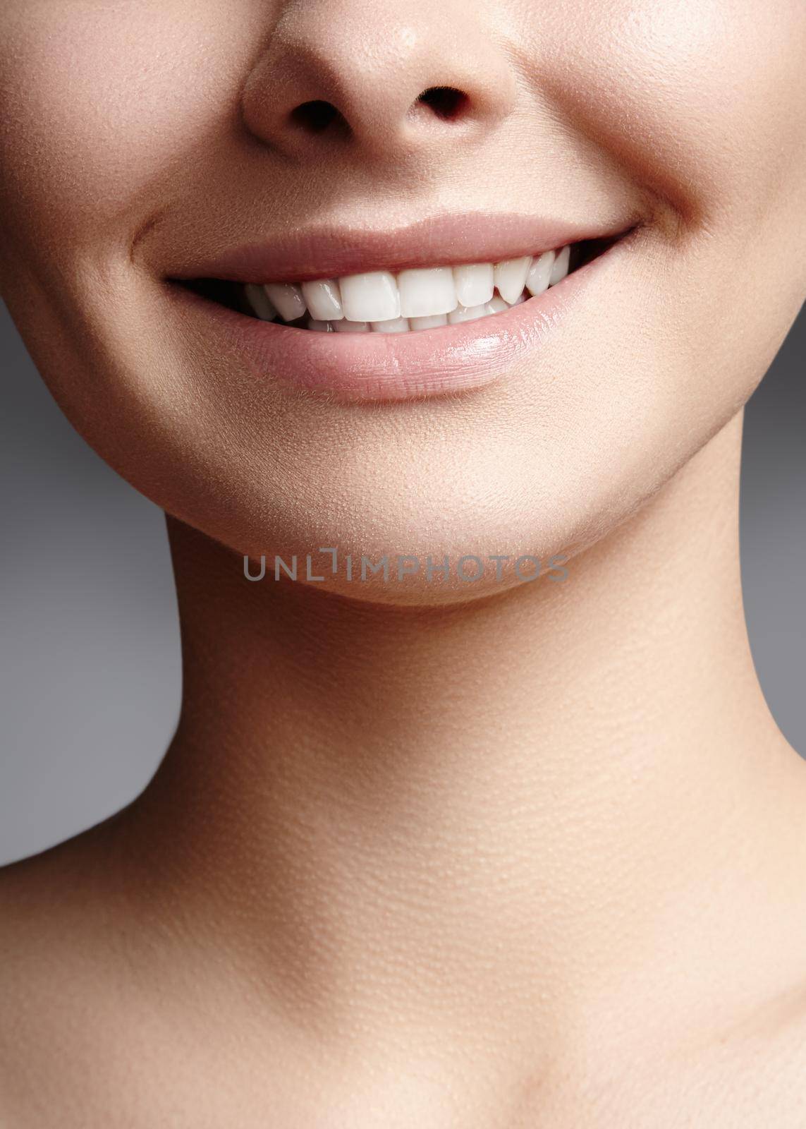 Wide smile of young beautiful woman, perfect healthy white teeth. Dental whitening, ortodont, care tooth and wellness by MarinaFrost