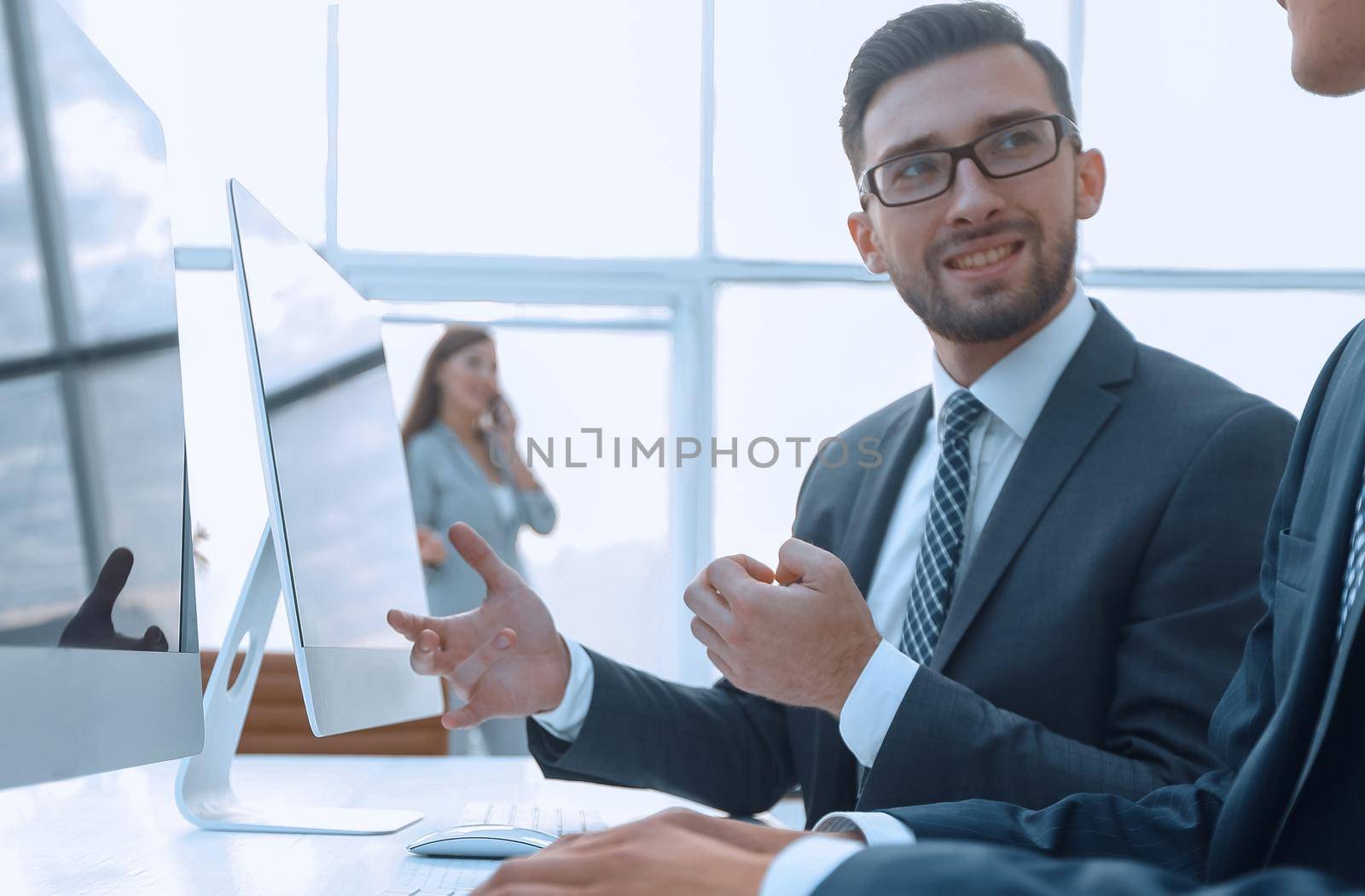 business colleagues sitting at their Desk on blurred background office