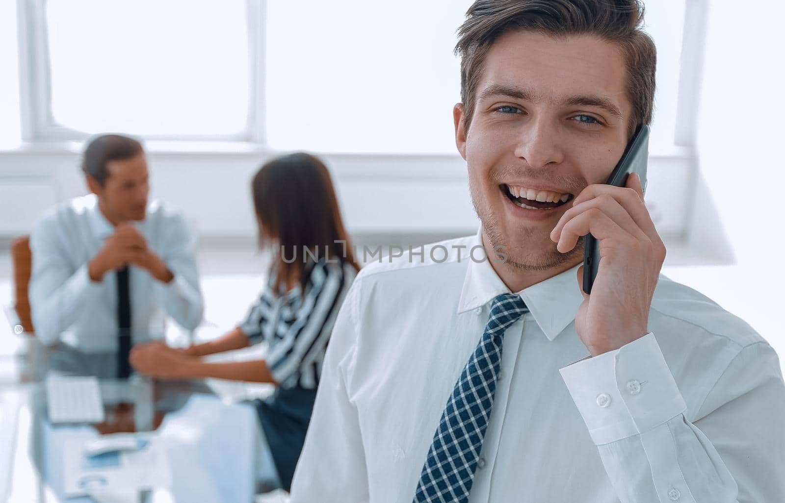 closeup.businessman talking on a mobile phone.photo with copy space