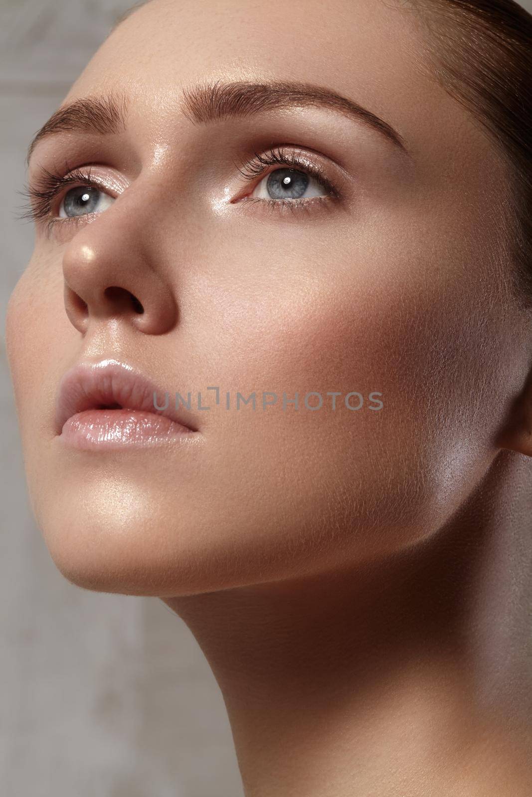 Beautiful young woman with perfect clean shiny skin, natural fashion makeup. Close-up woman, fresh spa look by MarinaFrost