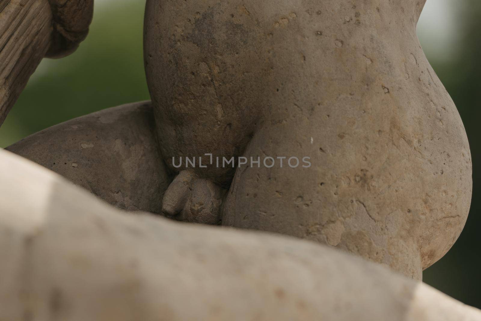 Warsaw, Poland - MAY 12, 2022: The photo of a penis of an old sculpture of the child in Royal Baths Park, Lazienki Park