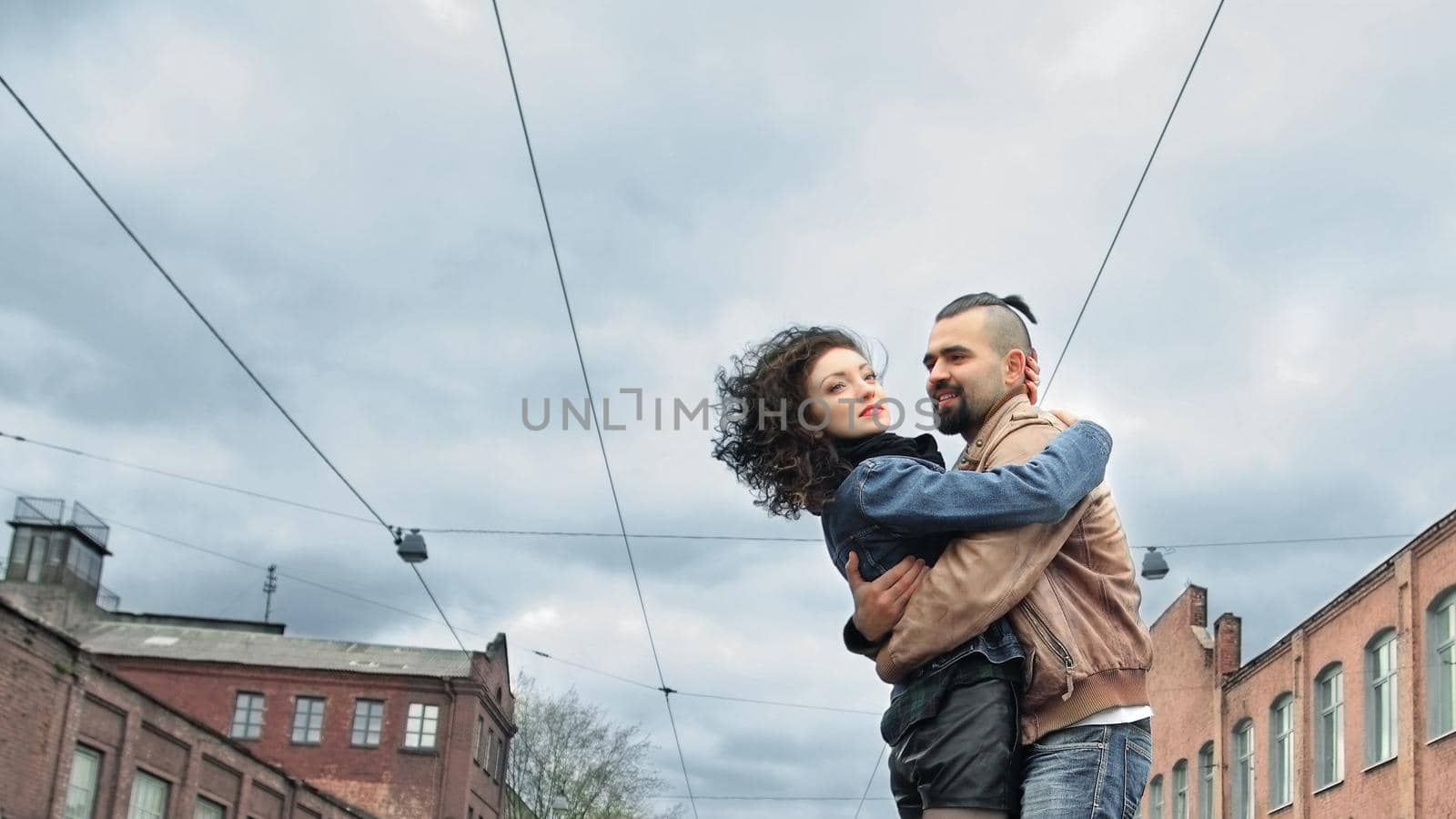 couple in love hugging standing on the street of the city by SmartPhotoLab