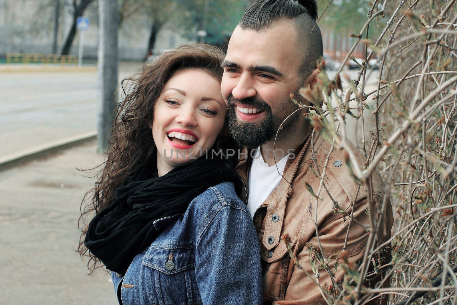 happy couple in love on a city street on a winter day. by SmartPhotoLab