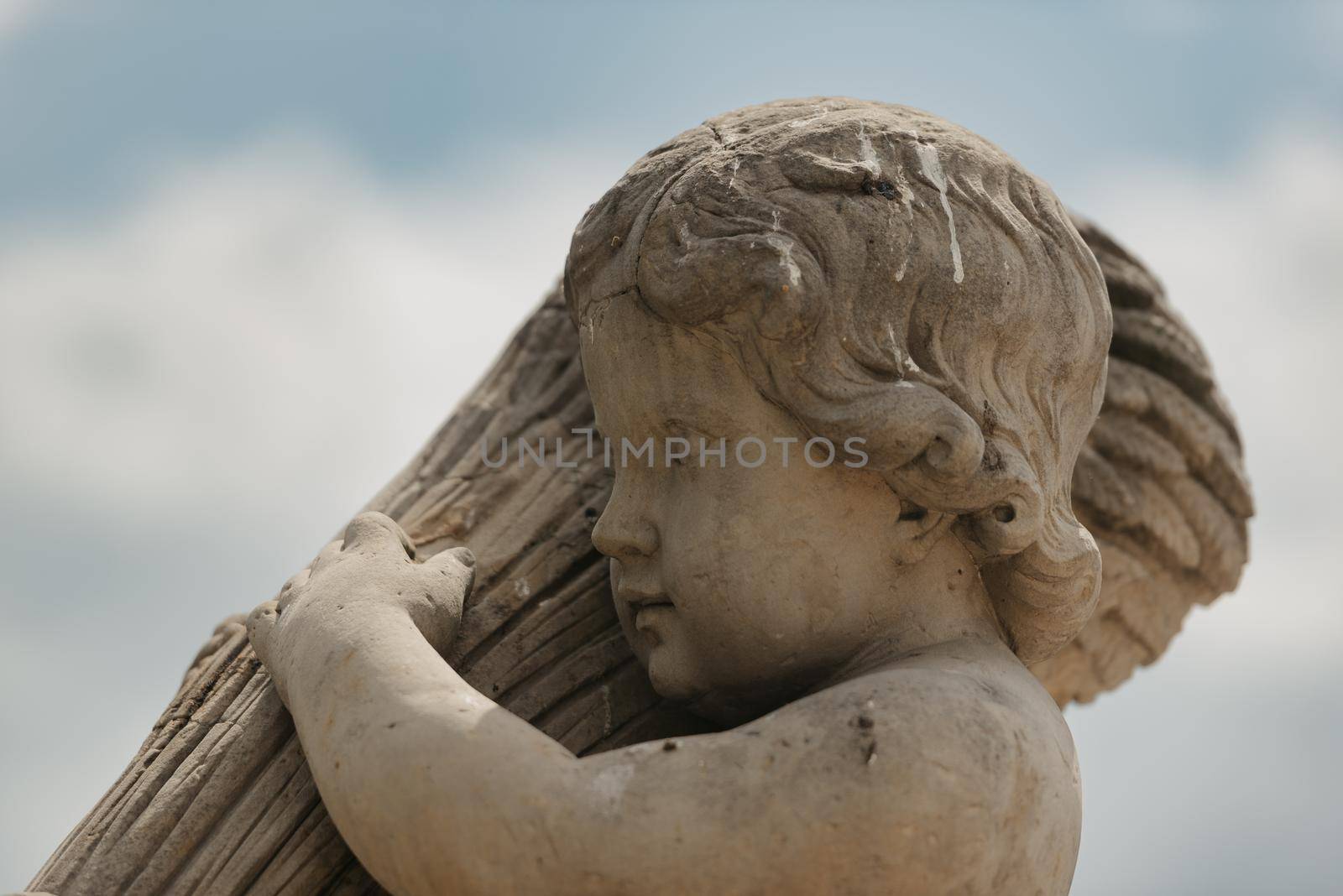 Warsaw, Poland - MAY 12, 2022: The headshot of an old sculpture of the child in Royal Baths Park, Lazienki Park