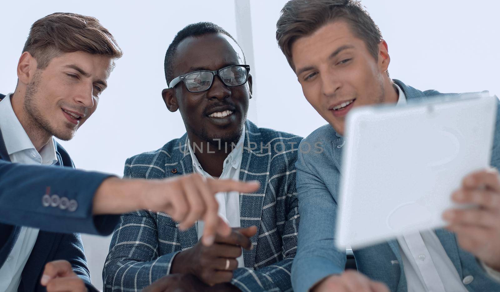 business colleagues looking at the digital tablet screen by asdf