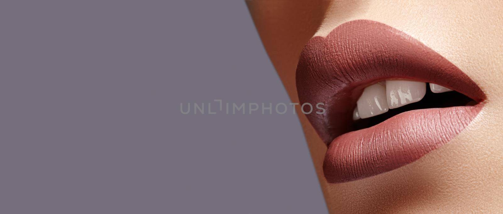 Close-up Female Full Lips with Fashion Natural coffee Lipstick Makeup. Macro Sexy Lip Stick Make-up. Mat Fashionable Style. Beauty Macro Shot