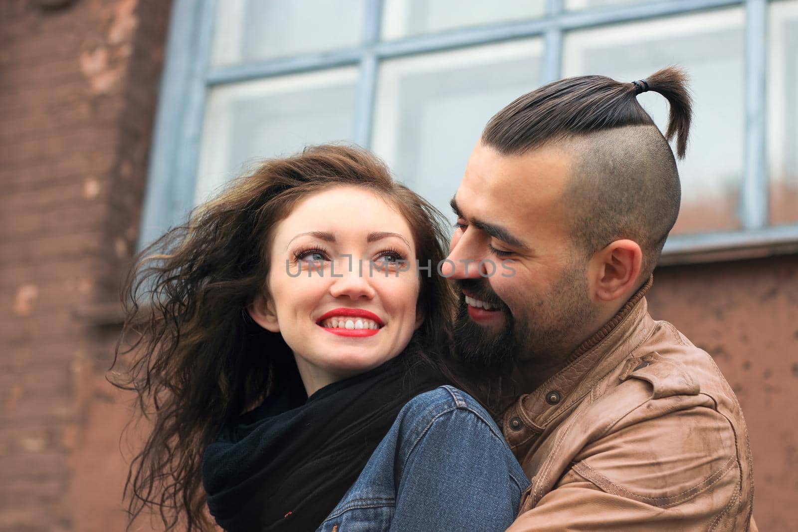 modern couple in love standing on the street of the city by SmartPhotoLab