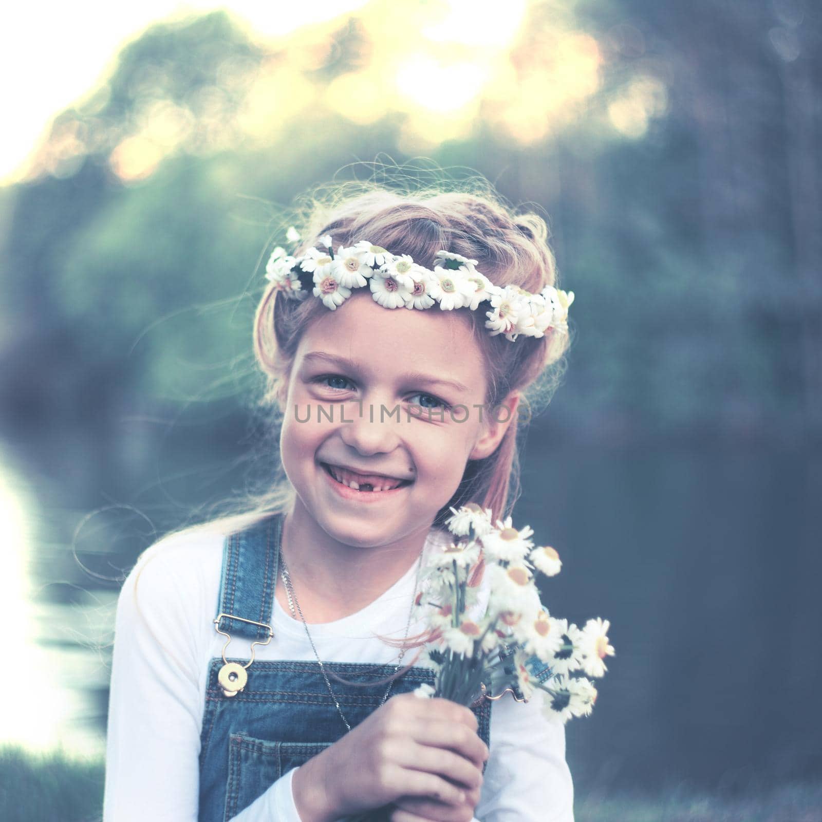 portrait of a little girl in a wreath of daisies and a bouquet o by SmartPhotoLab