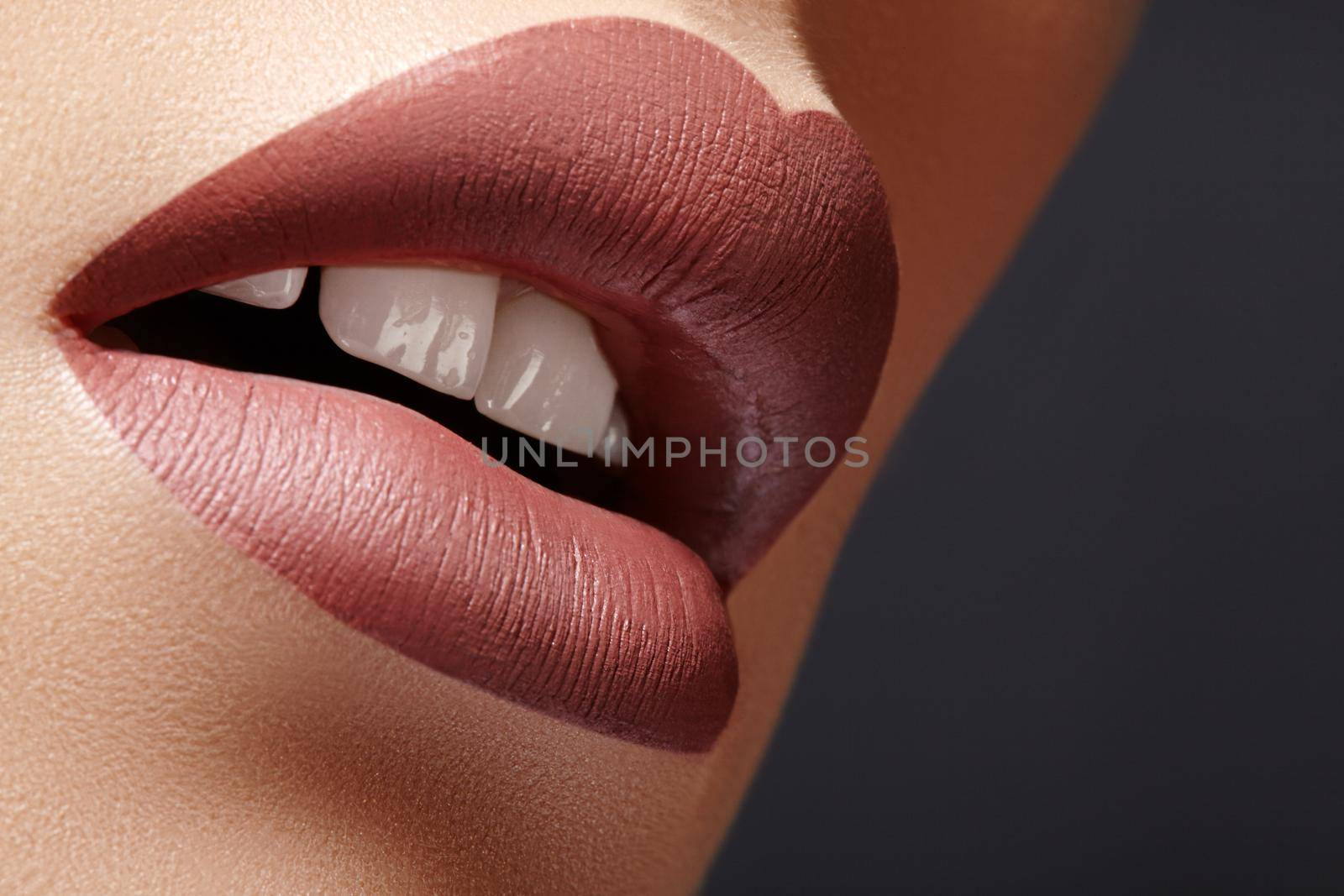 Close-up Female Full Lips with Fashion Natural coffee Lipstick Makeup. Macro Sexy Lip Stick Make-up. Mat Fashionable Style. Beauty Macro Shot