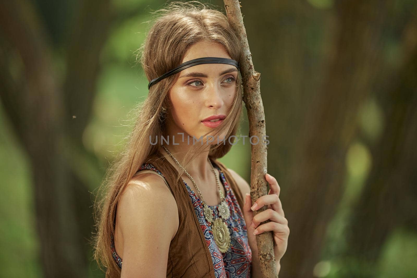 portrait of a beautiful woman hippies in a forest . the concept of unity with nature