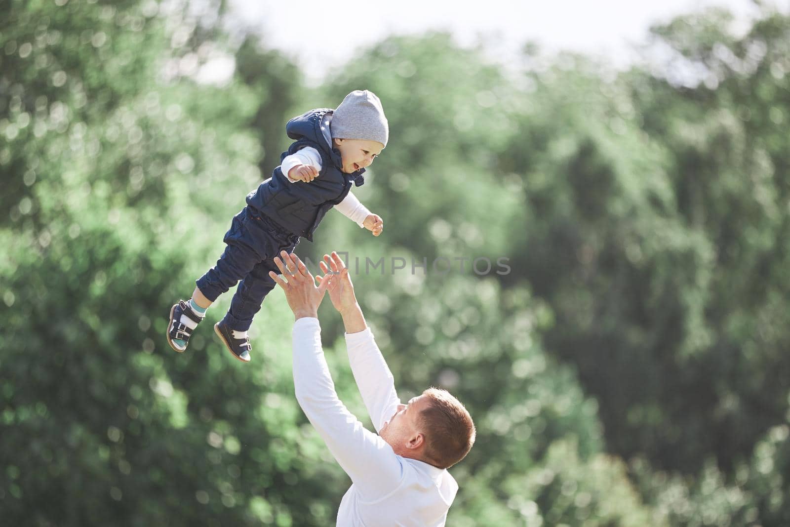 loving father and son on a walk in the spring Park. the concept of parenting