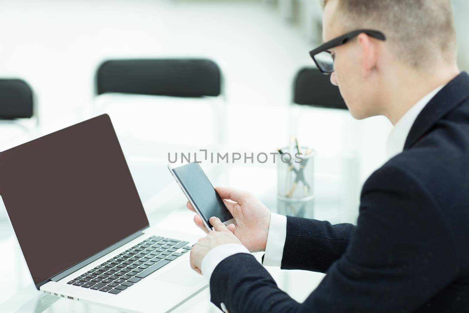 businessman planning a travel with a laptop, by SmartPhotoLab