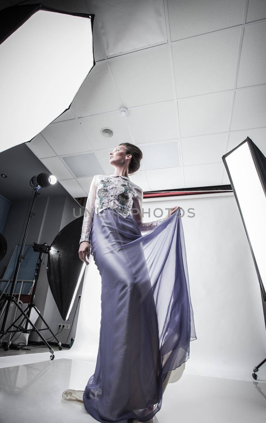 in full growth. beautiful woman model posing in a chic evening dress. beauty and fashion