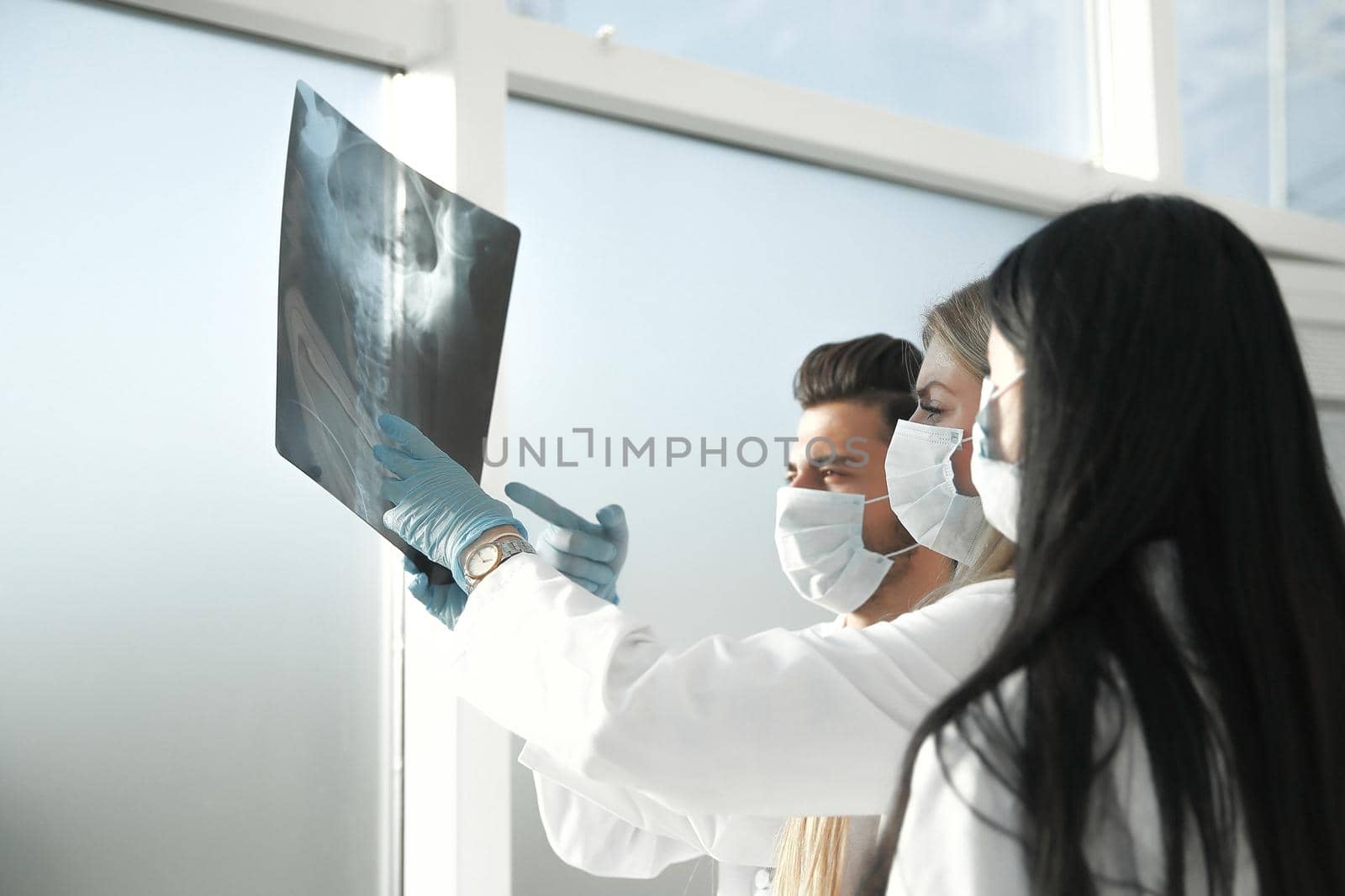 close up. a group of doctors discussing the x-ray .photo with copy space