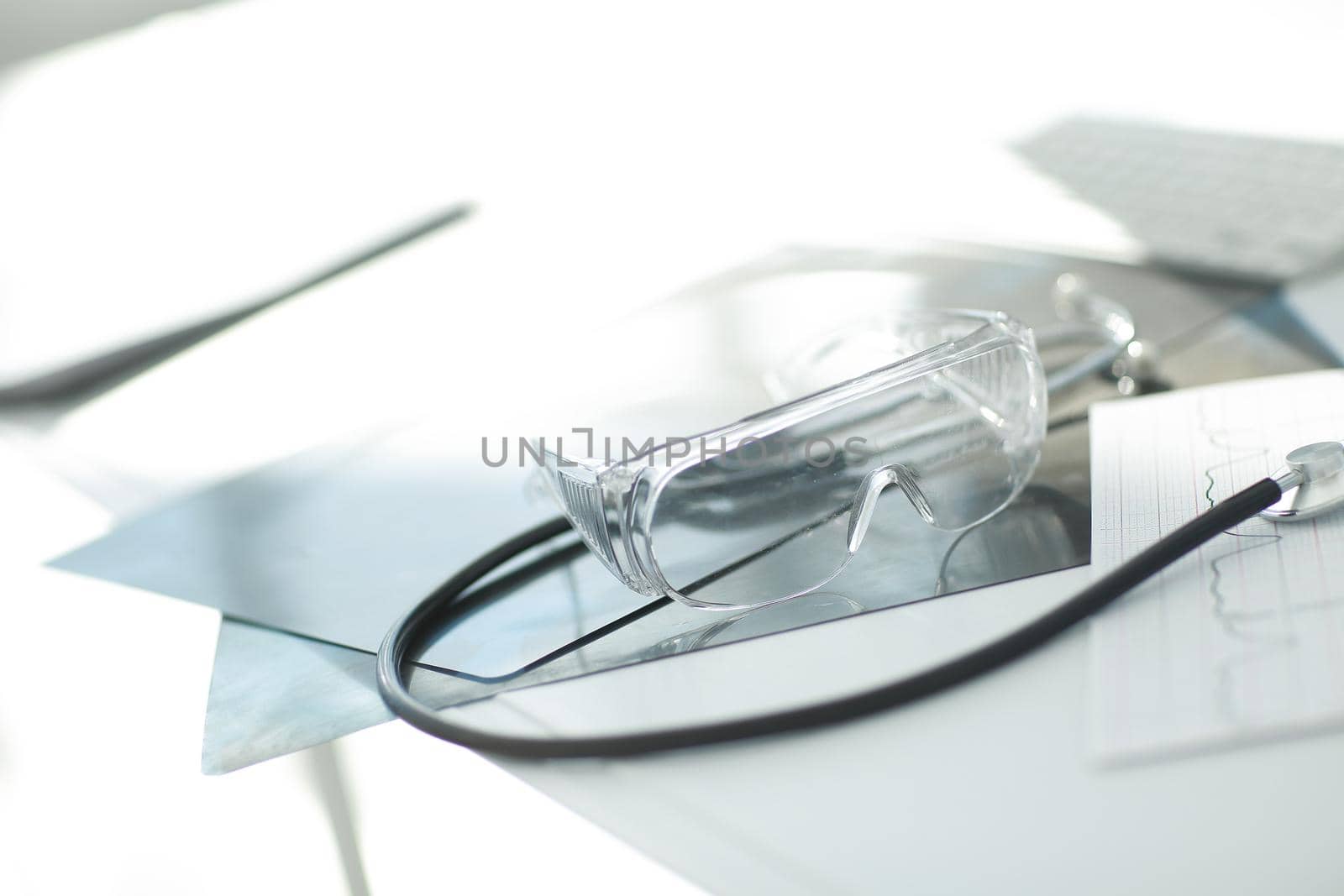 image stethoscope and documents on the table at the surgeon. photo with copy space