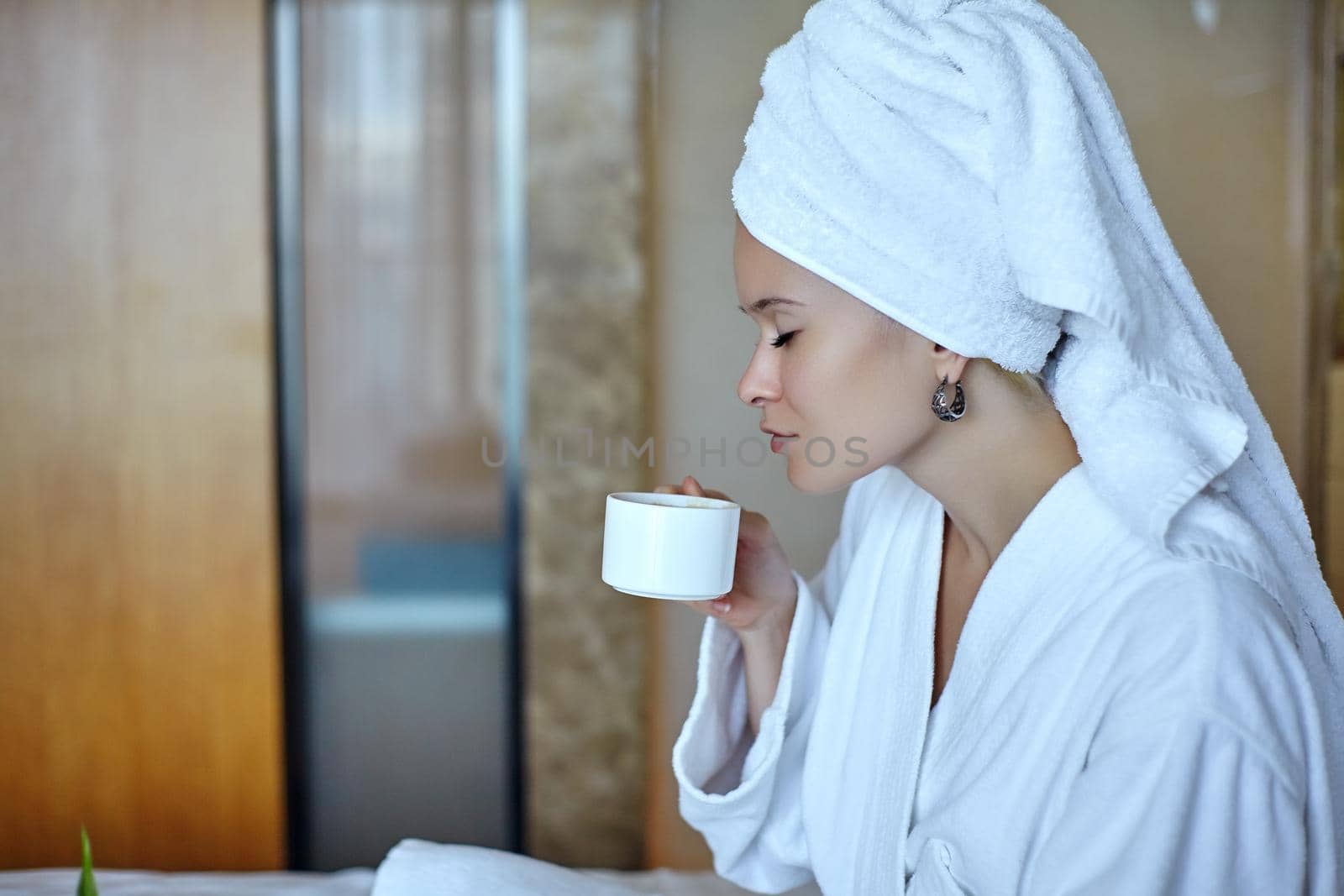 Beautiful Luxury Life. Breakfast. Happy Girl with a Cup of Coffee. Home Style Relaxation Woman Wearing Bathrobe and Towel after Shower. Spa Good Morning.
