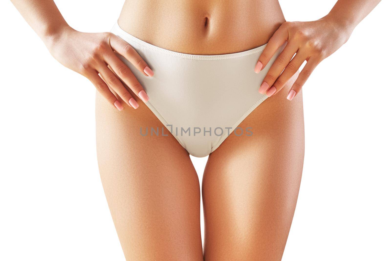 Spa and wellness. Healthy slim body in white panties. Beautiful sexy hips. Fitness or plastic surgery. Perfect buttocks without cellulite.