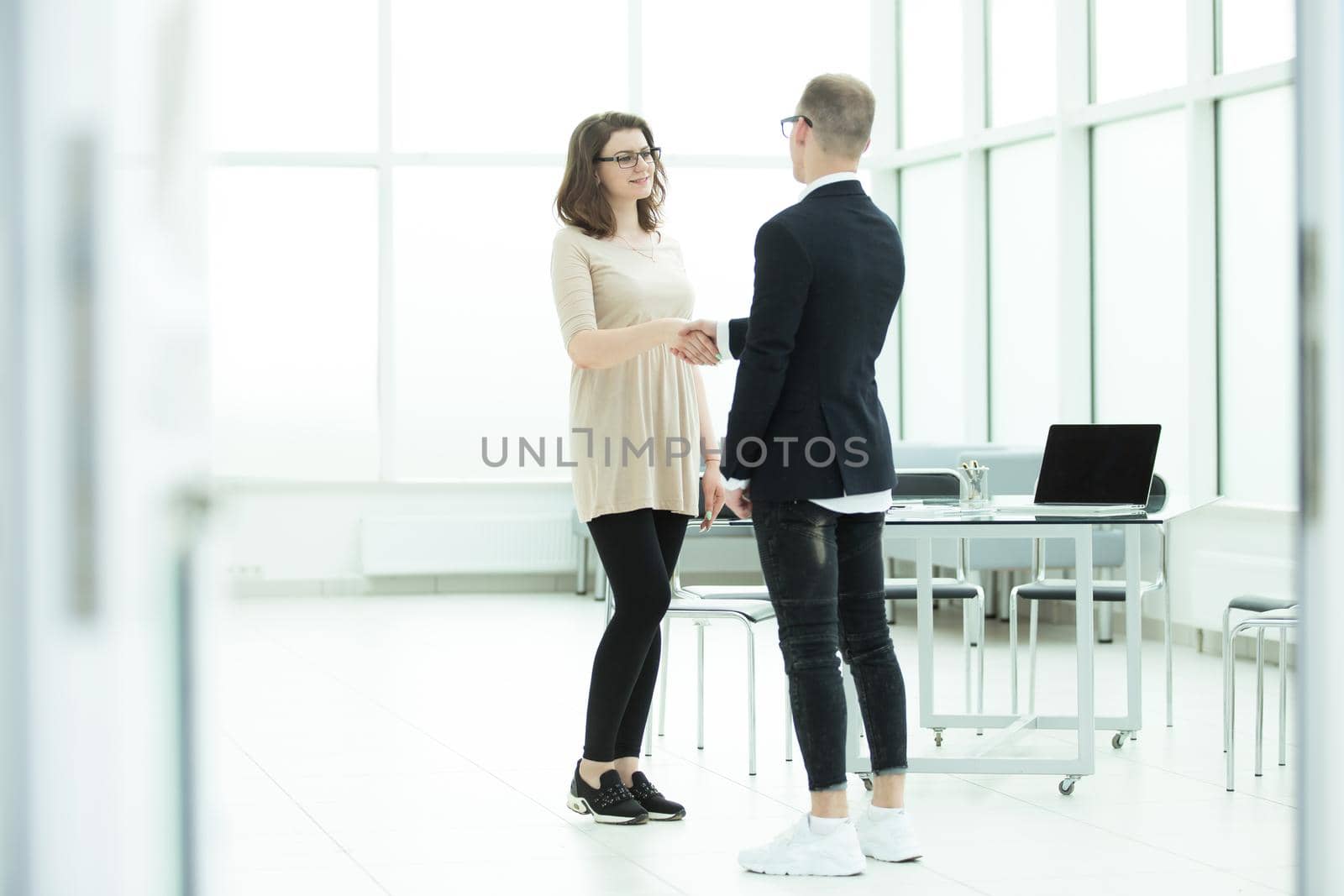 welcoming handshake of a Manager and the customer in the office by SmartPhotoLab