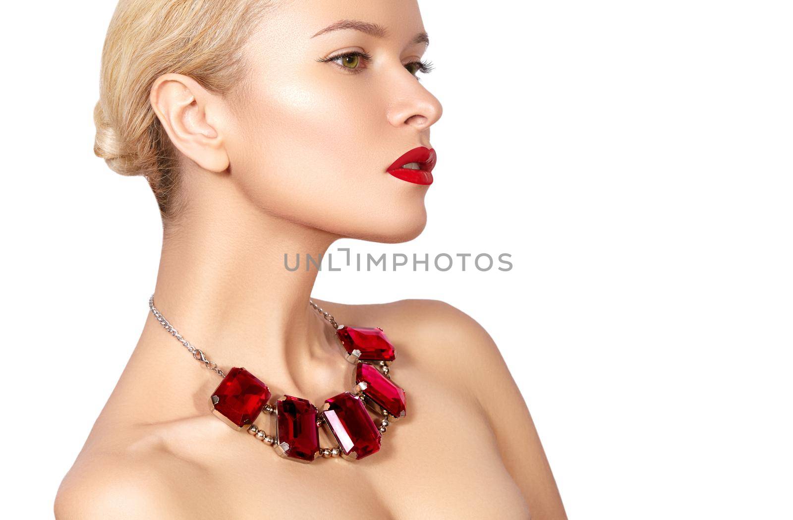 Fashion woman with elegant luxury jewelry. Beautiful girl with bright necklace on white background. Fashionable jewellery and accessories