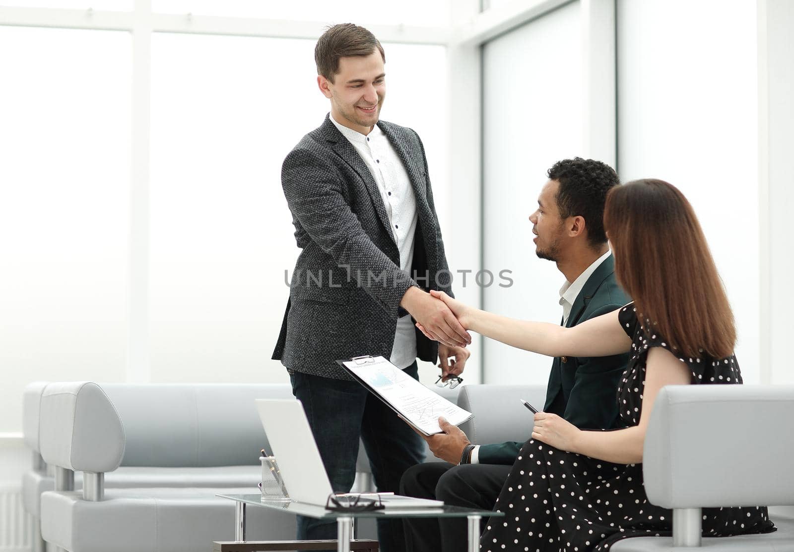 Manager welcomes customers in the lobby of the Bank. photo with copy space