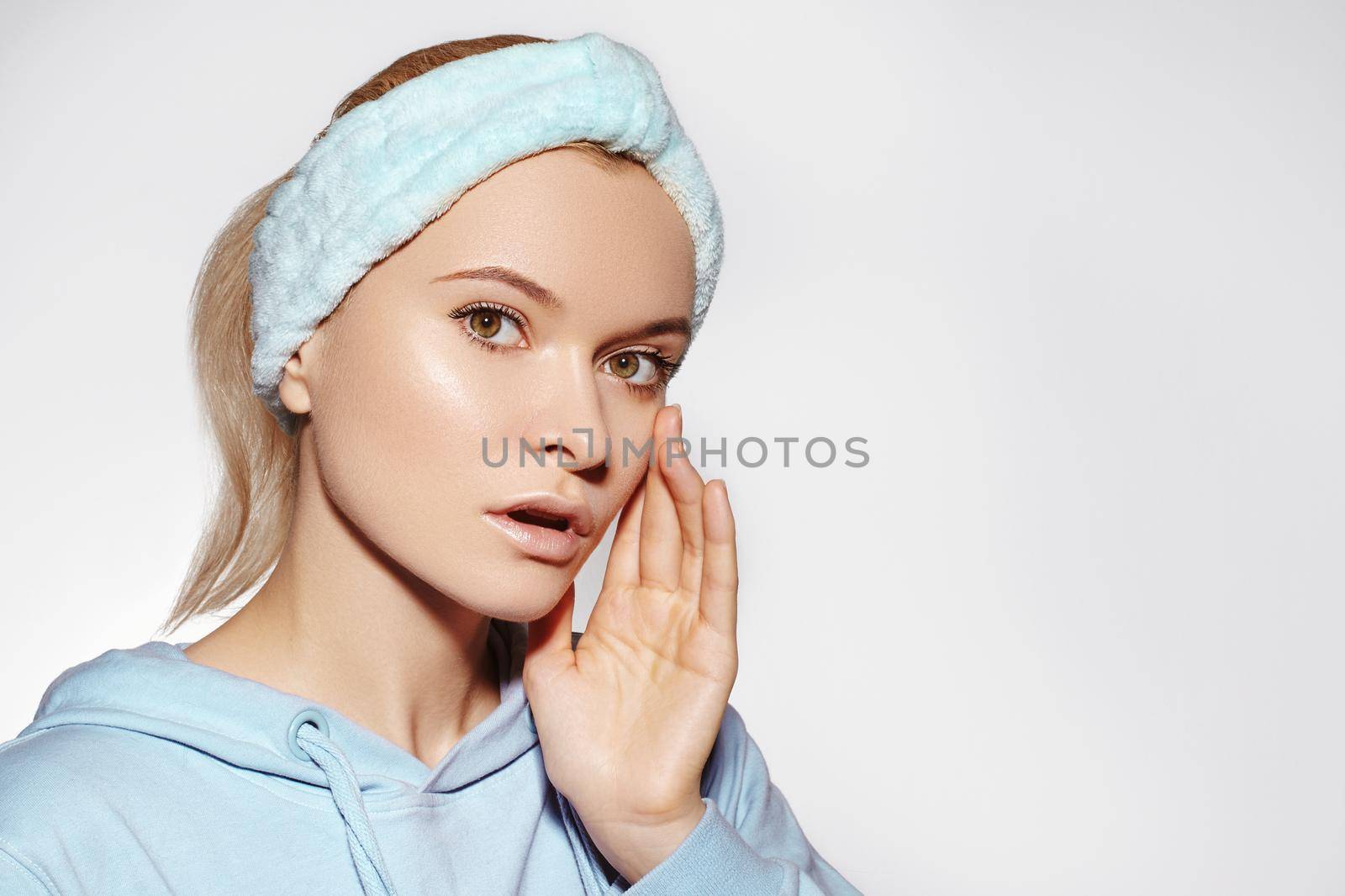 Beautiful Woman show Fresh Clean Face, no Make-up, Perfect Clean Skin. Pretty Girl in soft Headband. Morning Hygiene, Daily Beauty Facial and Skin Care Routine. Skin Hydration