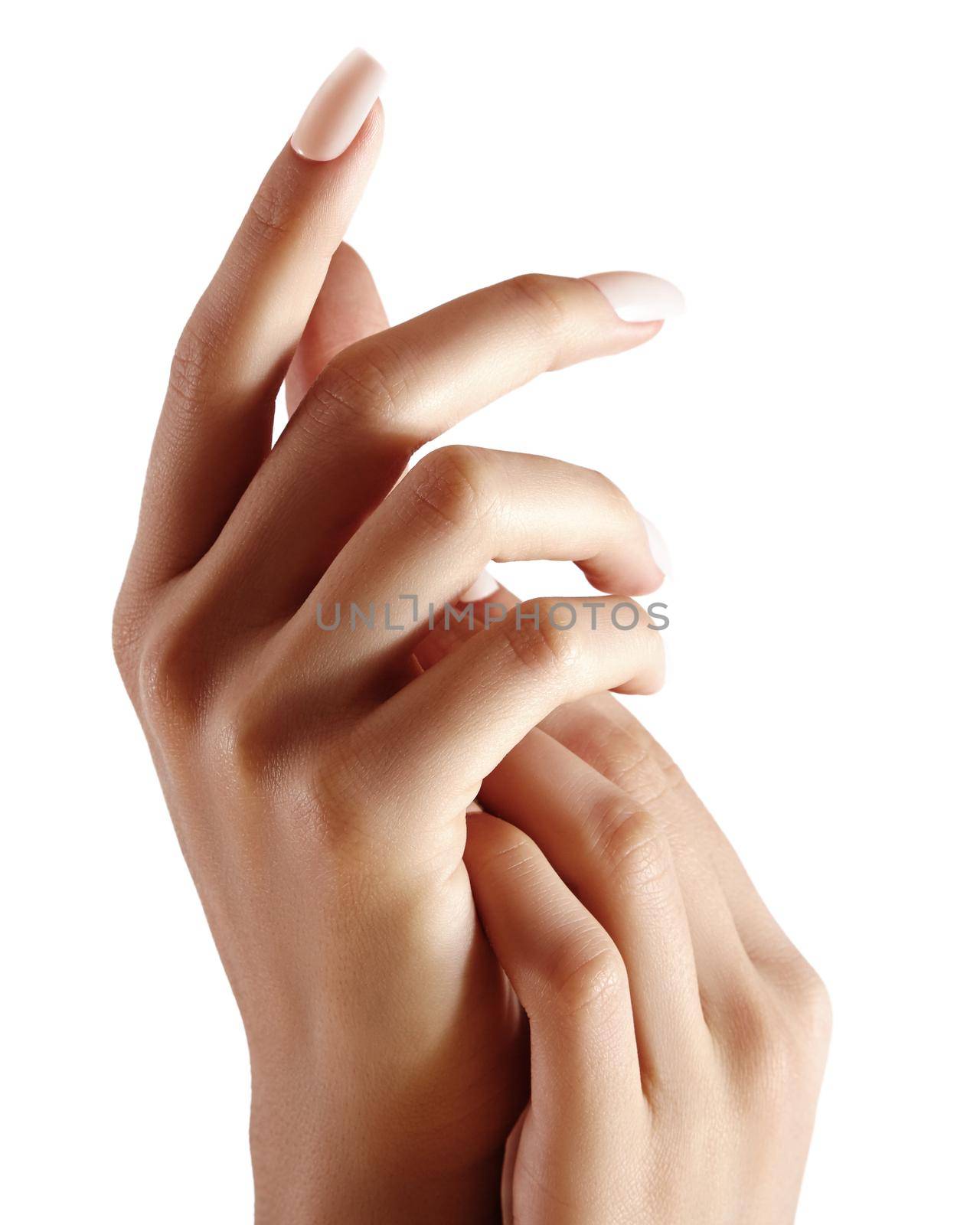 Beautiful woman's hands on light background. Care about hand. Tender palm with natural manicure, clean skin. Light beige nails